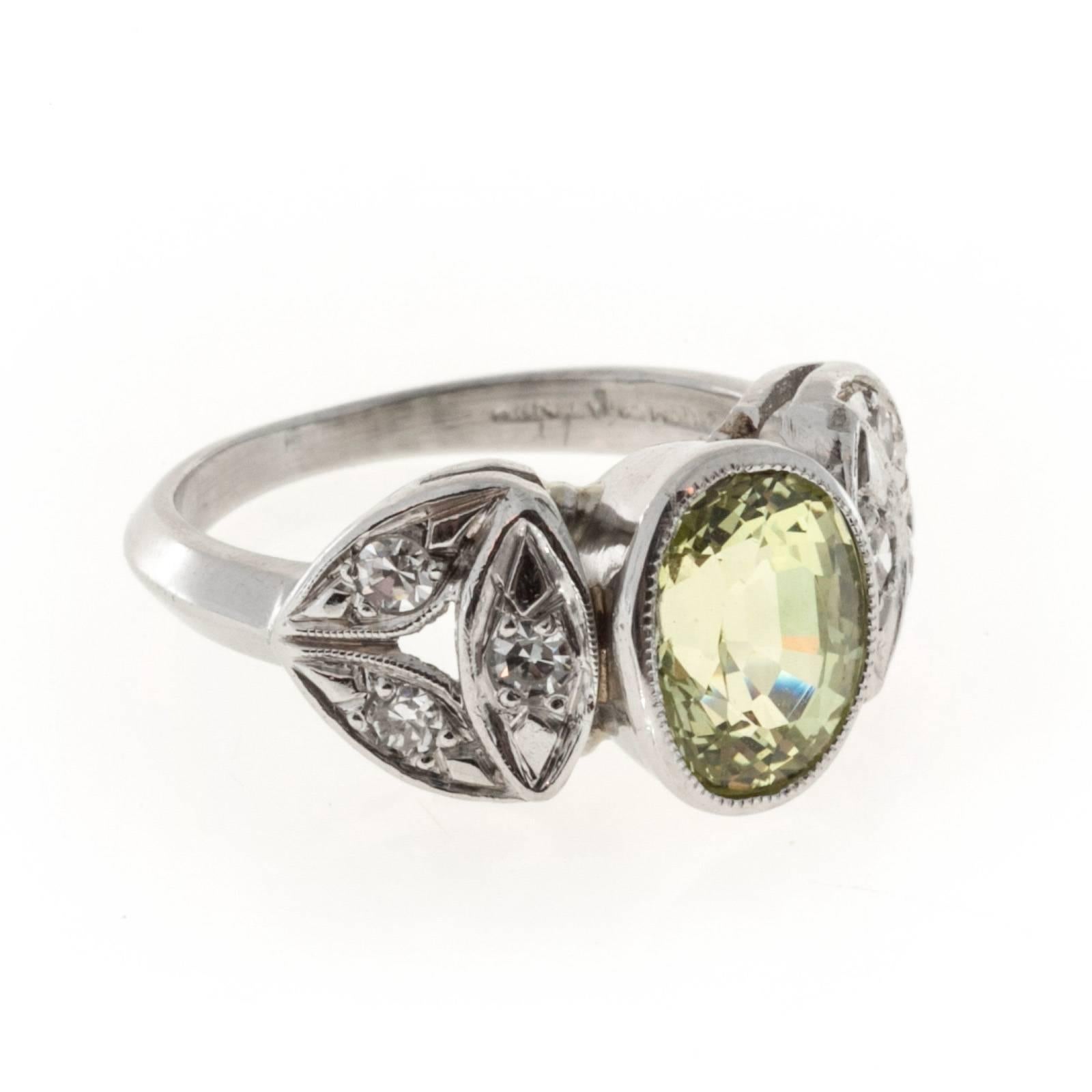 Late Art Deco 1940 handmade Platinum ring with all natural greenish  Chrysoberyl 2.61ct center and nice single cut side diamonds. AGL

1 natural oval Chrysoberyl, approx. total weight 2.61cts, VS, 8.91 x 6.89 x 5.45mm, AGL certificate #GB109545
6