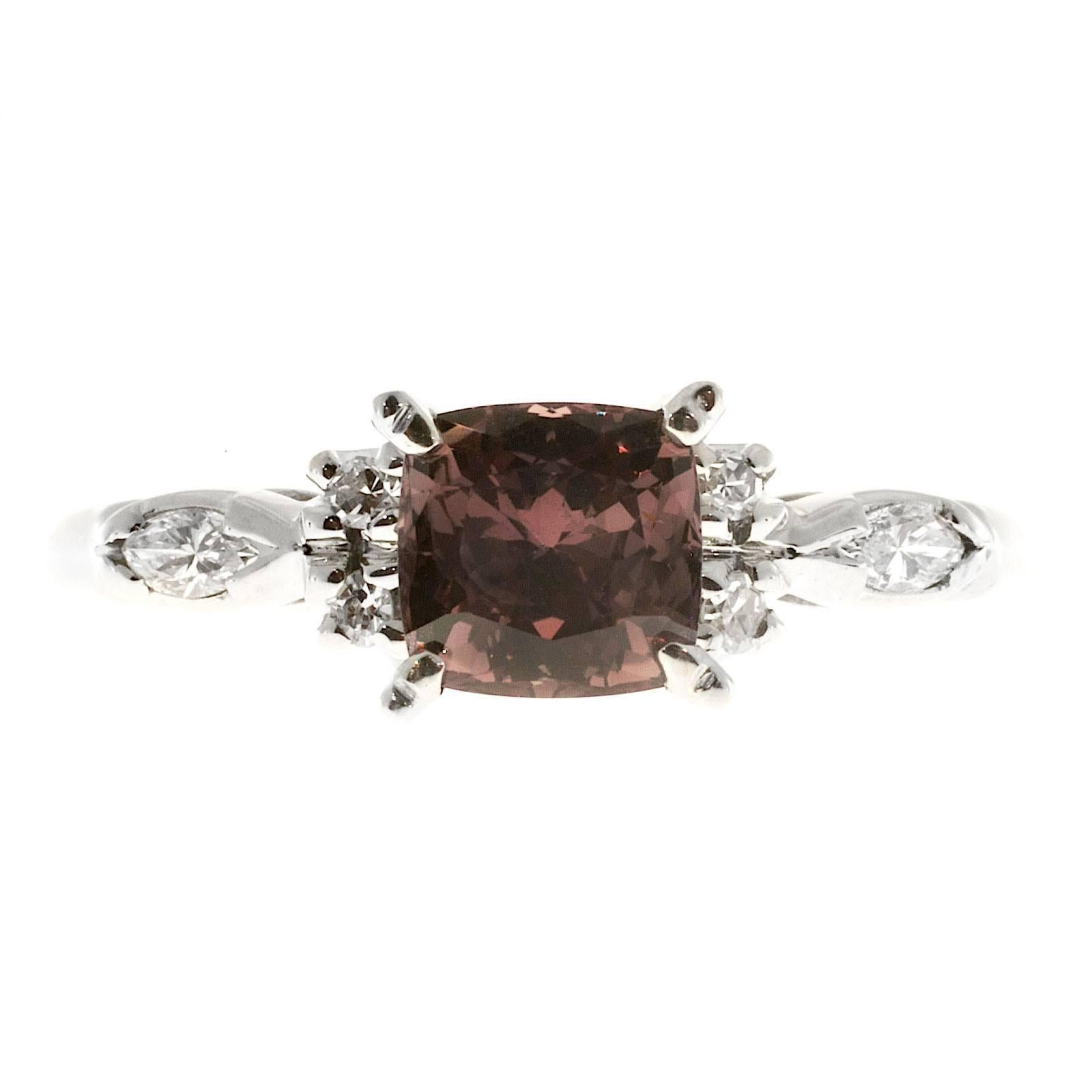 Raspberry Brown Pink 1.30ct natural Sapphire showing different shades of pink and reddish brown in different lights. 18k white gold setting with round and marquise side diamonds. 

1 Natural no heat and no enhancement cushion shape Sapphire, approx.