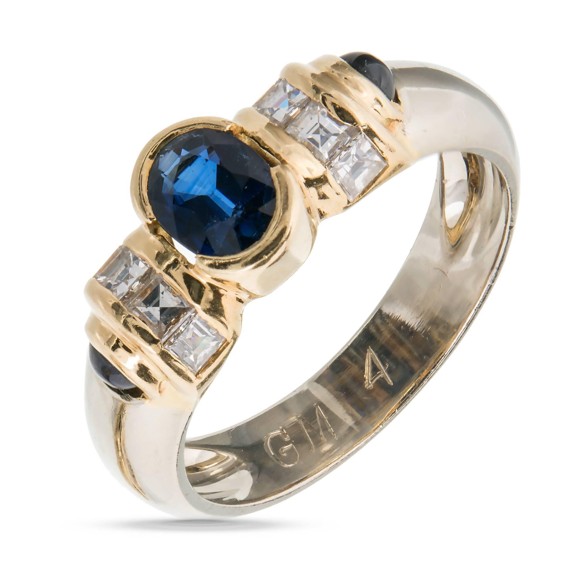Oval Cabochon Sapphire Square Diamond Gold Engagement Ring

1 6 x 4 oval fine deep blue Sapphire, approx. total weight .60cts
2 2.5mm cabochon deep blue Sapphires
8 square step cut diamonds, approx. total weight .40cts, F, VS
Tested: 18k white gold