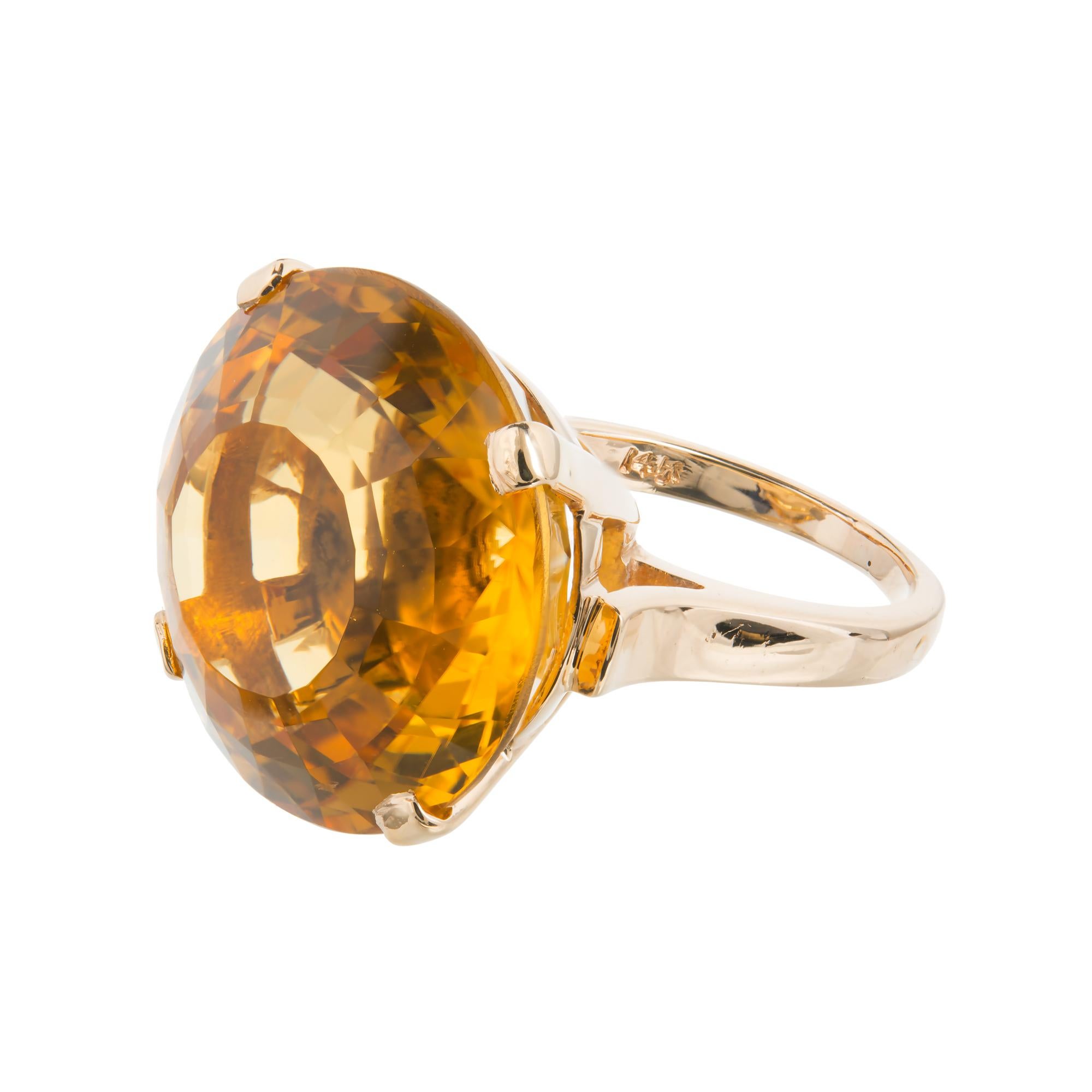 20.00ct. golden yellow Citrines cocktail ring. Extremely well-polished with raised crown and small table.

1 round golden yellow with a hint of orange top gem Citrine, approx. total weight 20.00cts, VS, 20.4mm, natural color no enhancements
Size 6