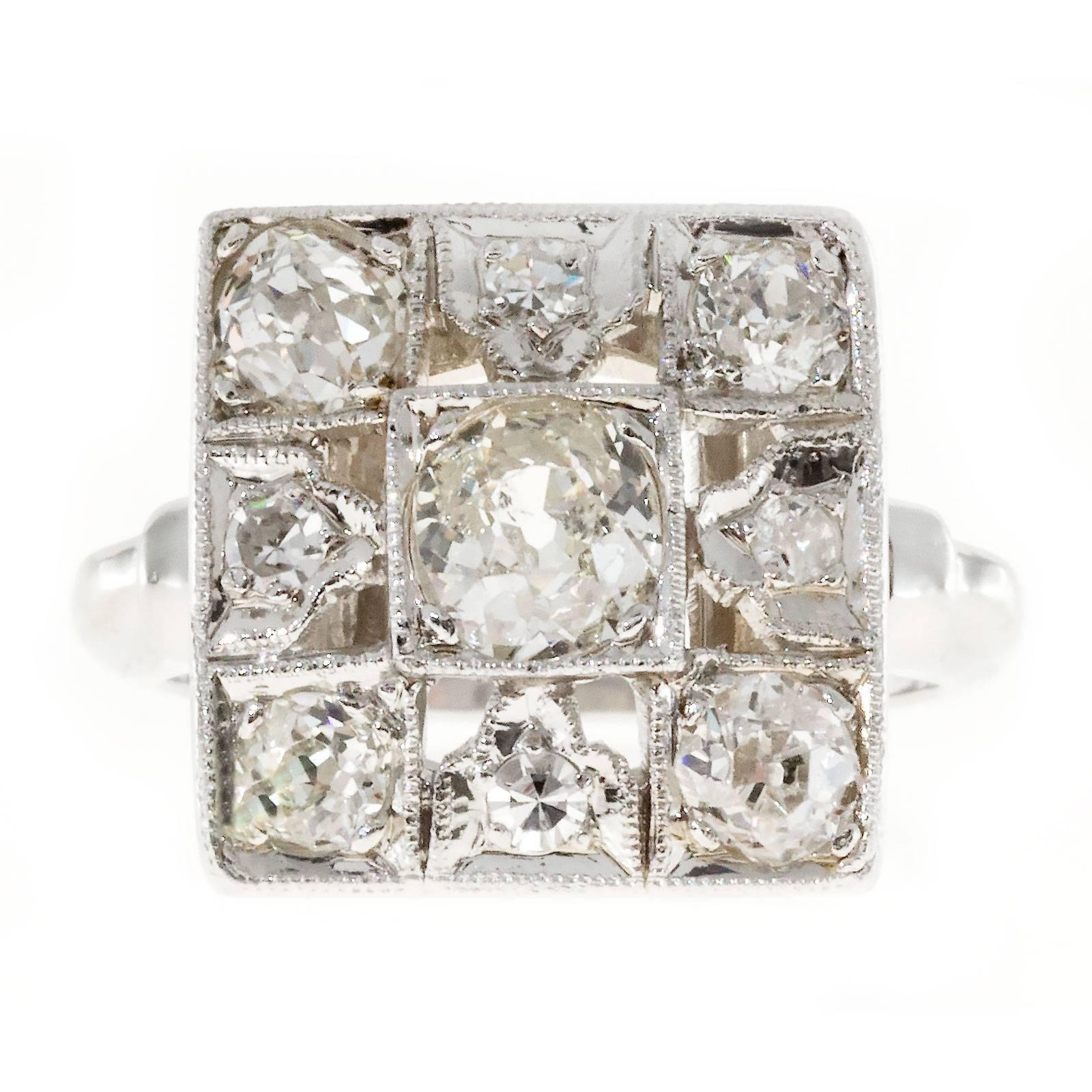 Old mine diamond pierced square top ring in solid Platinum, circa 1920's 

1 old mine cut diamond, approx. total weight .50cts, J, SI1
4 old mine cut diamonds, approx. total weight .70cts, I, SI1
4 single cut diamonds, approx. total weight