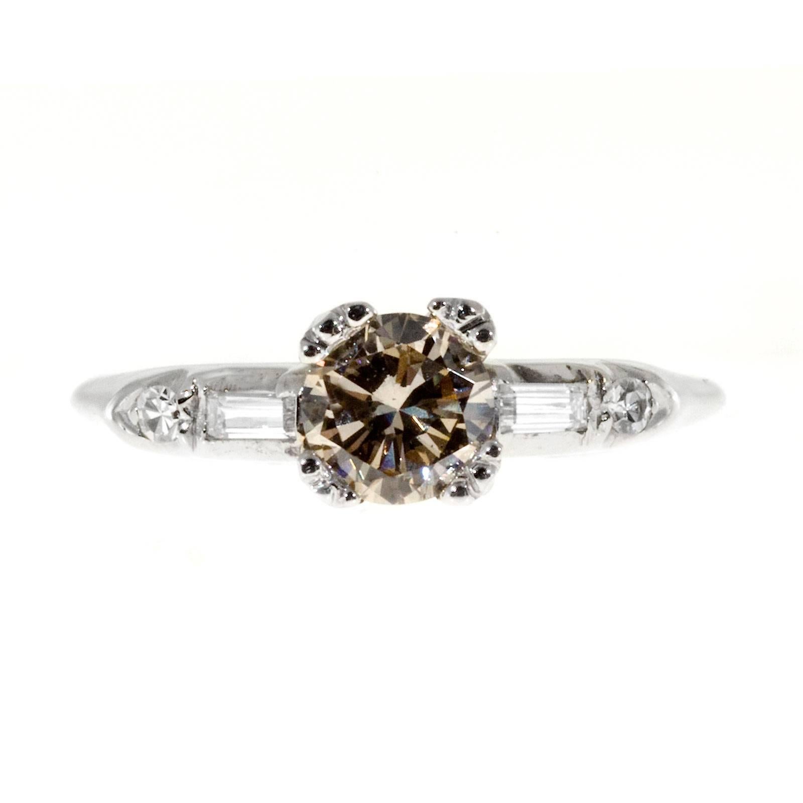 18k white gold late Art Deco engagement ring with a genuine certified light brown diamond with a hint of pink. Circa 1930-1939.

1 GIA certified #1122987883 light brown diamond approx. total weight .60cts, W to X range.SI2 eye clean, slight pink