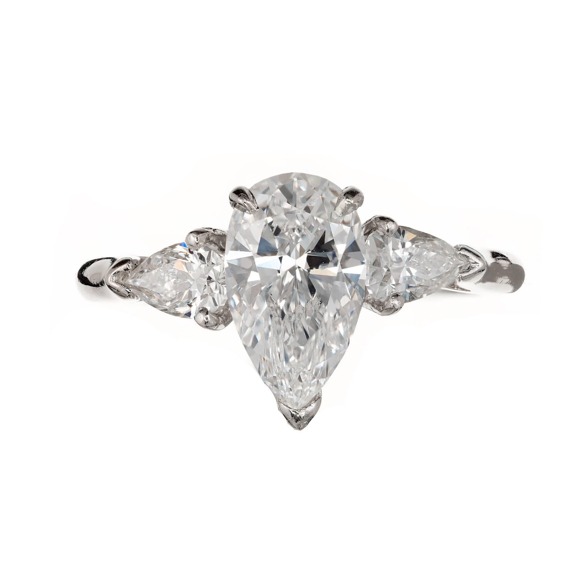 Pear shaped diamond Handmade Platinum three-stone engagement ring. Pear shape diamond, 1.63cts, with two pear shaped side stones . 

1 pear shape GIA certified #15318446 1.63ct F, VS2  62.1%depth, 60% table
2 pear shape side diamonds approx. total
