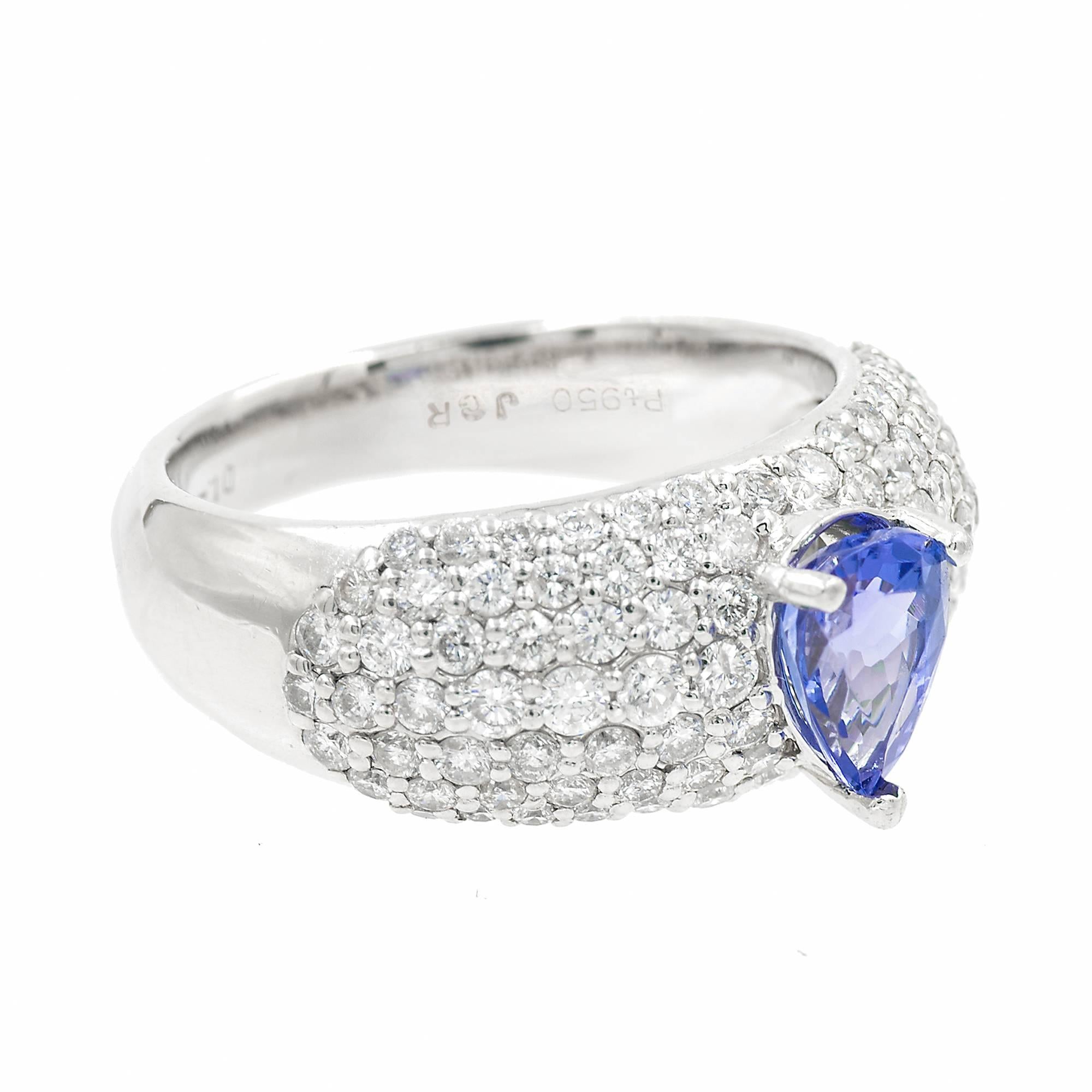 Pear shaped Blue tanzanite cocktail ring with Bead set rows of diamonds in a platinum setting. 

1 pear shape Tanzanite approx. total weight .75cts
98 round diamonds approx. total weight 1.20cts, G, VS2-SI1
Size 6 and sizable
Platinum
Stamped: 950