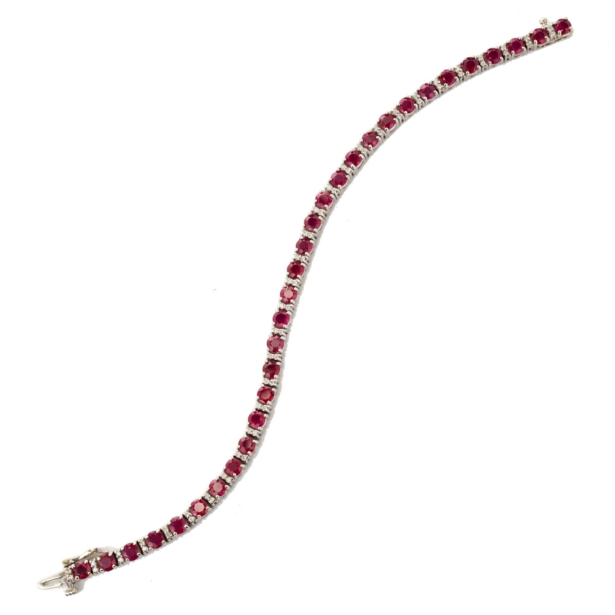 Red Ruby and diamond 14k white gold tennis bracelet. Bright red natural rubies and full cut diamonds. Side lock safety and built in catch.

62 full cut diamonds, approx. total weight .35cts, G-H, VS
31, 4mm genuine blood red Rubies, approx. total