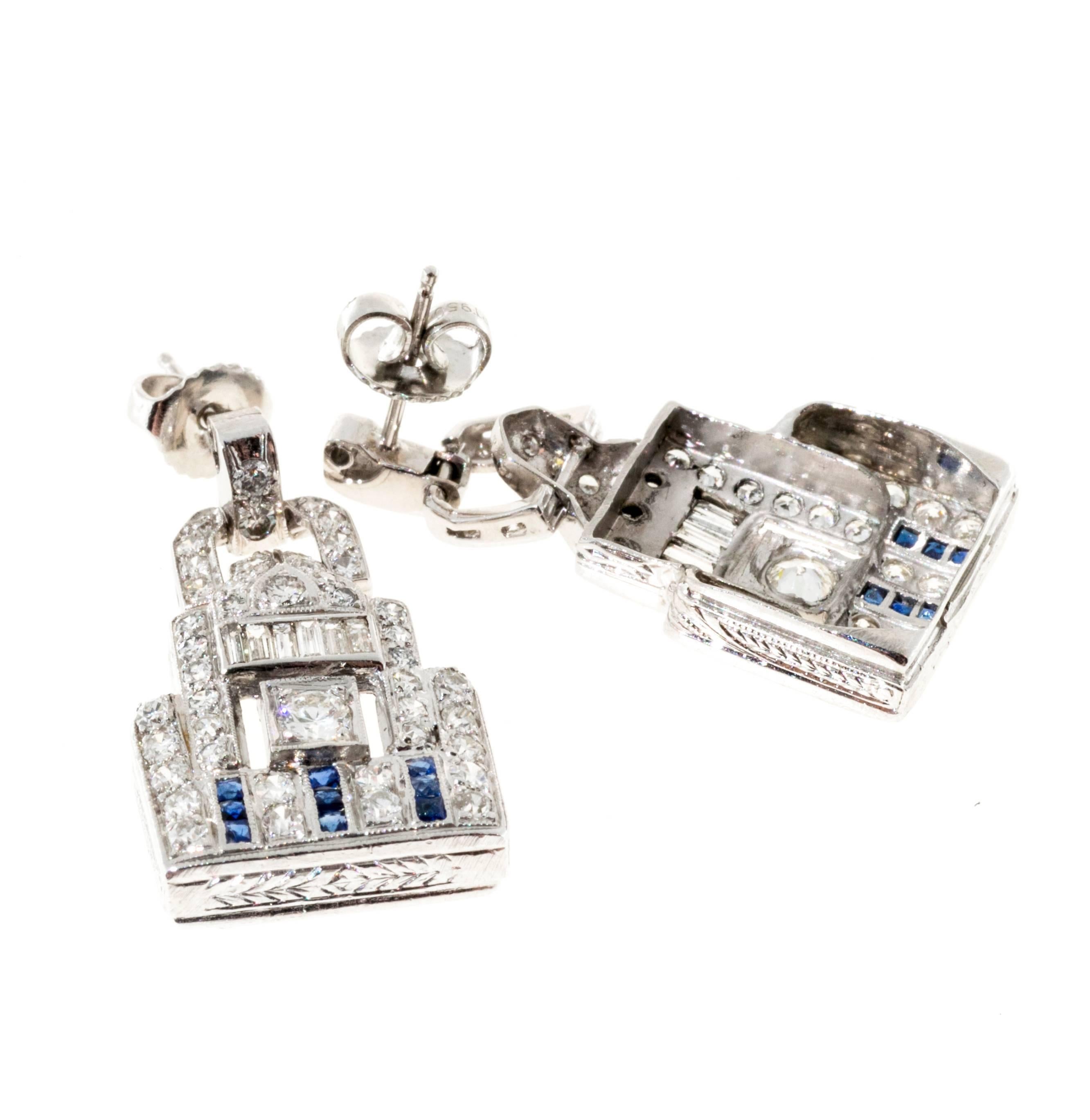 Sapphire and diamond Platinum dangle earrings.  Colorless, bright shiny diamonds and bright deep blue Sapphires. 

18 French calibre cut genuine Sapphires approx. total weight .33cts
12 straight baguette diamonds approx. total weight 2.00cts,