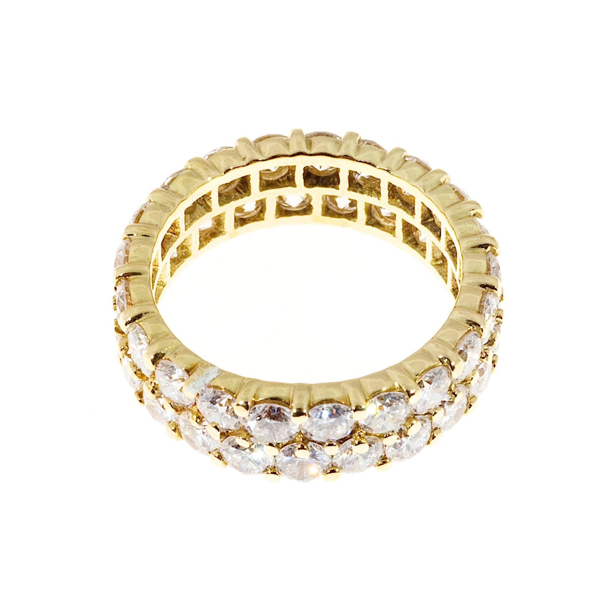  Hammerman Brothers 18k yellow gold 2 row common prong F, VS Ideal cut eternity ring.

48 round Ideal full cut diamonds, approx. total weight 3.90cts, F, VS
18k Yellow Gold
Stamped: 18k HB 39
Width all around: 6.2mm
Height: 2.7mm
5.8