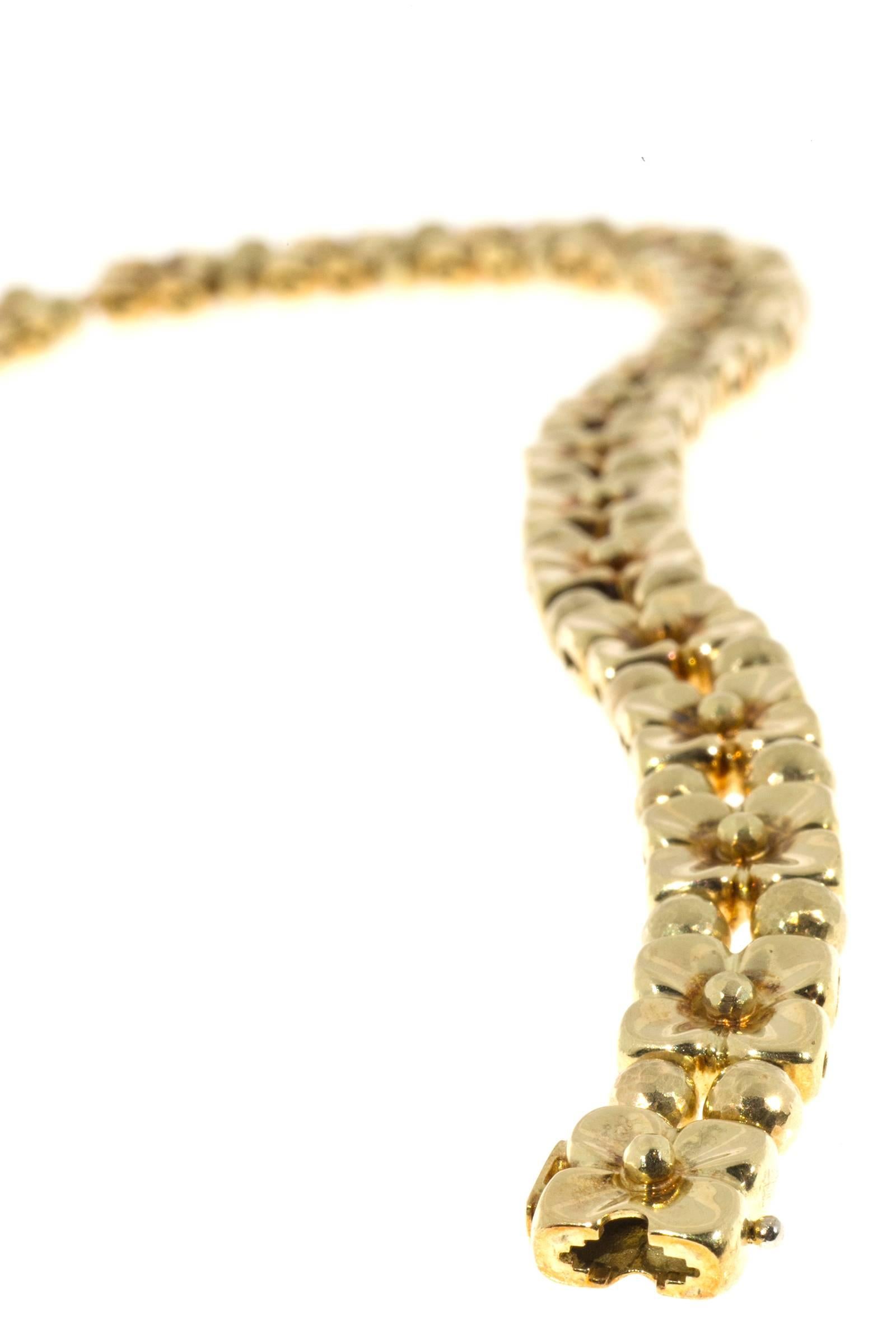 18k Italian textured greenish gold necklace with 25 round  F, VS diamonds.  Strung on 2 rows of 18k cable chain. Plain shiny flowers on one side and textured flowers on  the other. 

25 round diamonds .04cts each totally 1.00cts, F, VS
18k Yellow