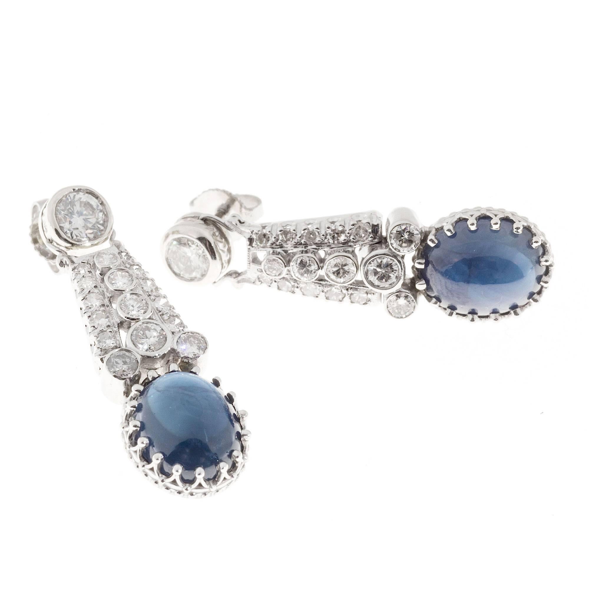 1920-1929 dangle earrings. Platinum and white gold. The center   diamond sections are handmade Platinum with white diamonds. At the top is a white gold handmade engraved side bezel set   with very bright transitional cut diamonds. At the bottom are