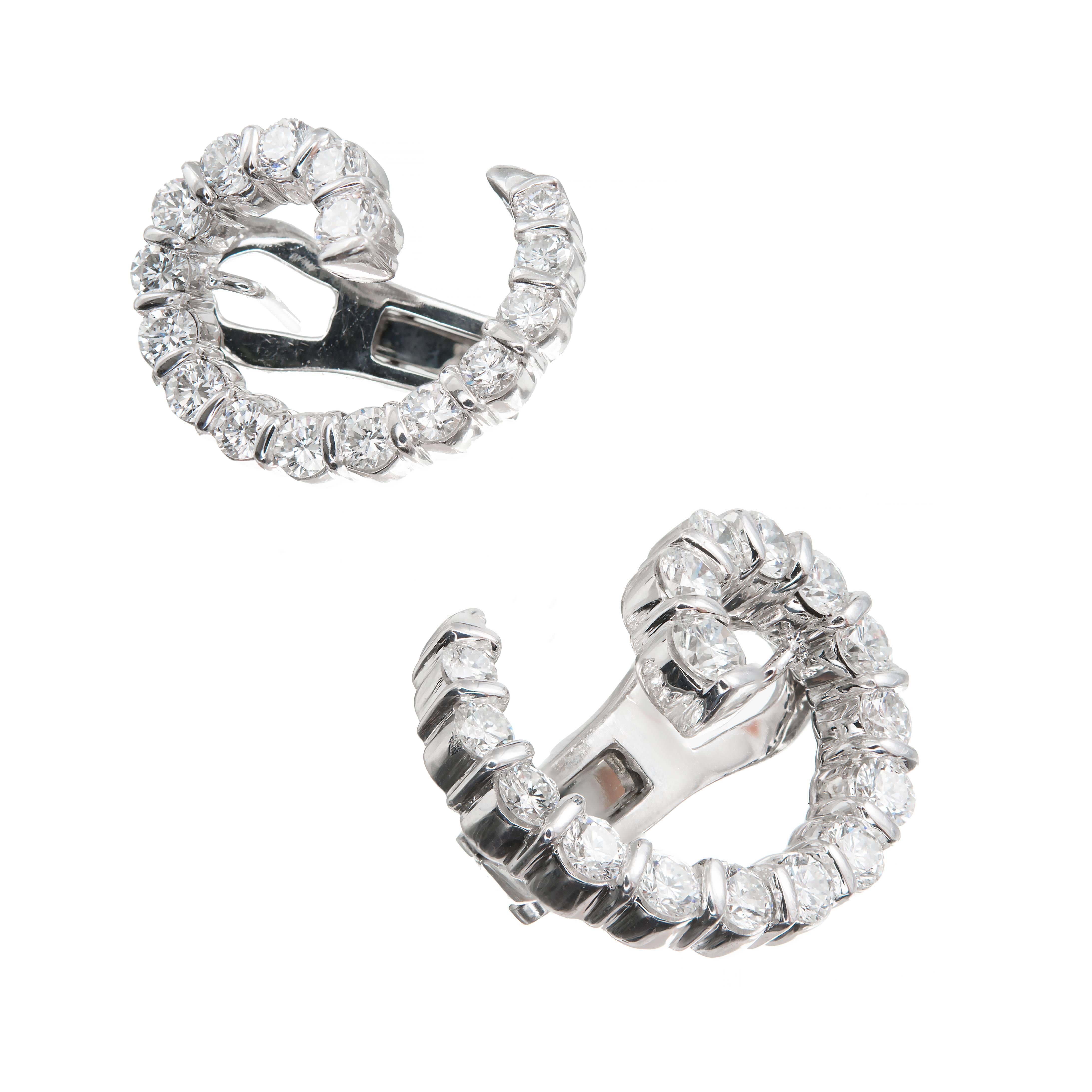 Authentic Gemlok Platinum Ideal clip post swirl earrings with F, VVS Ideal cut diamonds.

32 round Ideal cut diamonds, approx. total weight 2.00cts, F, VVS
Platinum
Tested: Platinum
Stamped: Plat
Hallmark: Gemlok
13.9 grams
Top to bottom: