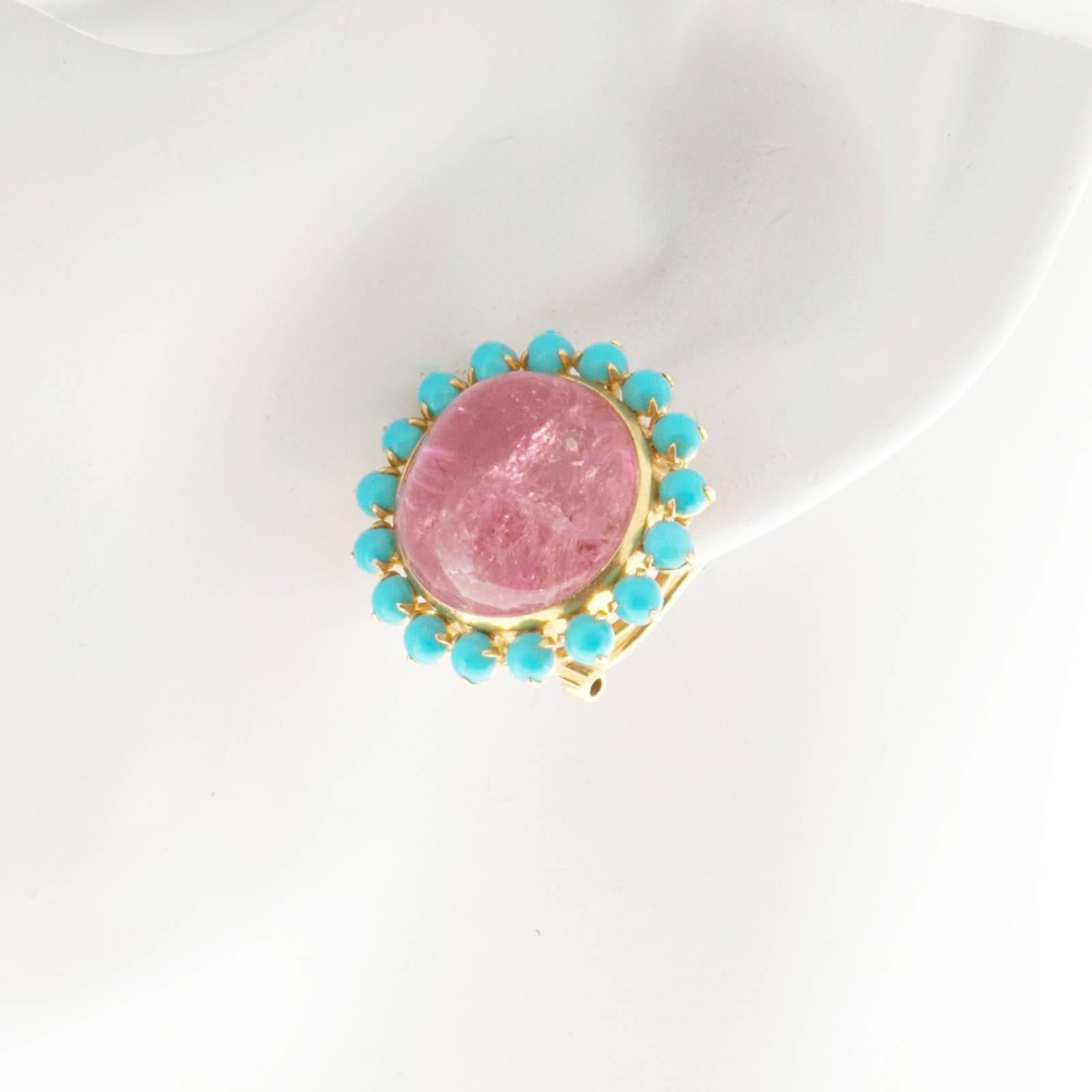 1950’s clip post 15mm pink Tourmaline Persian untreated Turquoise earrings. Moderately included Tourmaline. Persian Turquoise.

2 round cabochon pink Tourmaline 15.54 x 15.33 x 10.74mm
34 round cabochon natural Persian Turquoise 3 – 3.5mm
18k
