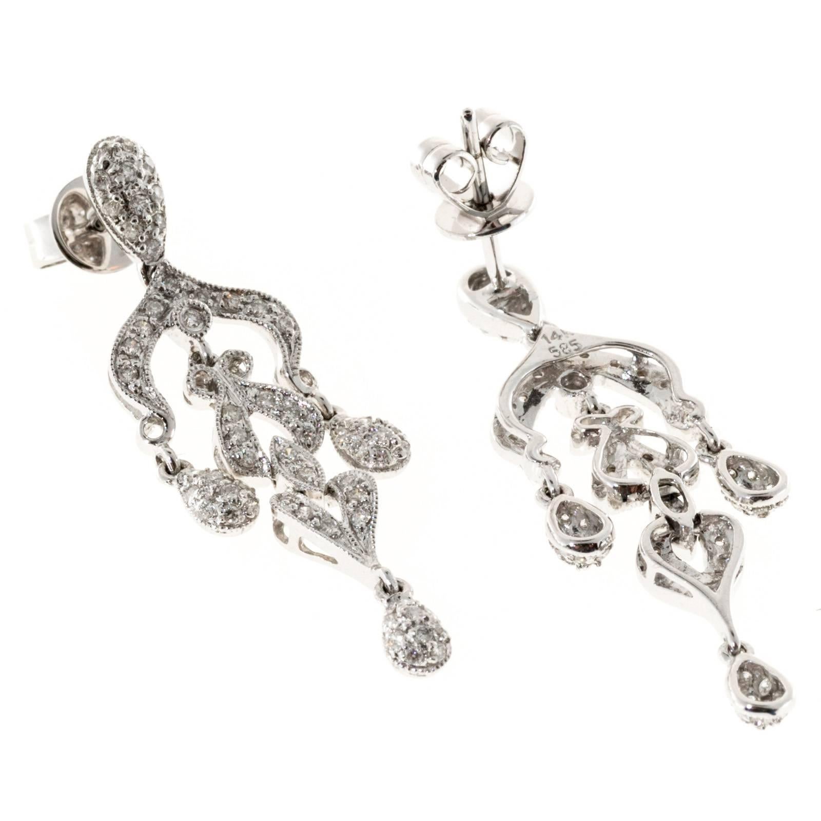 Chandelier style 14k white gold dangle earrings. 

124 round full cut diamonds, approx. total weight .75cts, H, VS – SI
14k white gold
Tested: 14k
Stamped: 14k 585
5.2 grams
Top to bottom: 38.05mm or 1.50 inches
Width: 10.92mm or .43