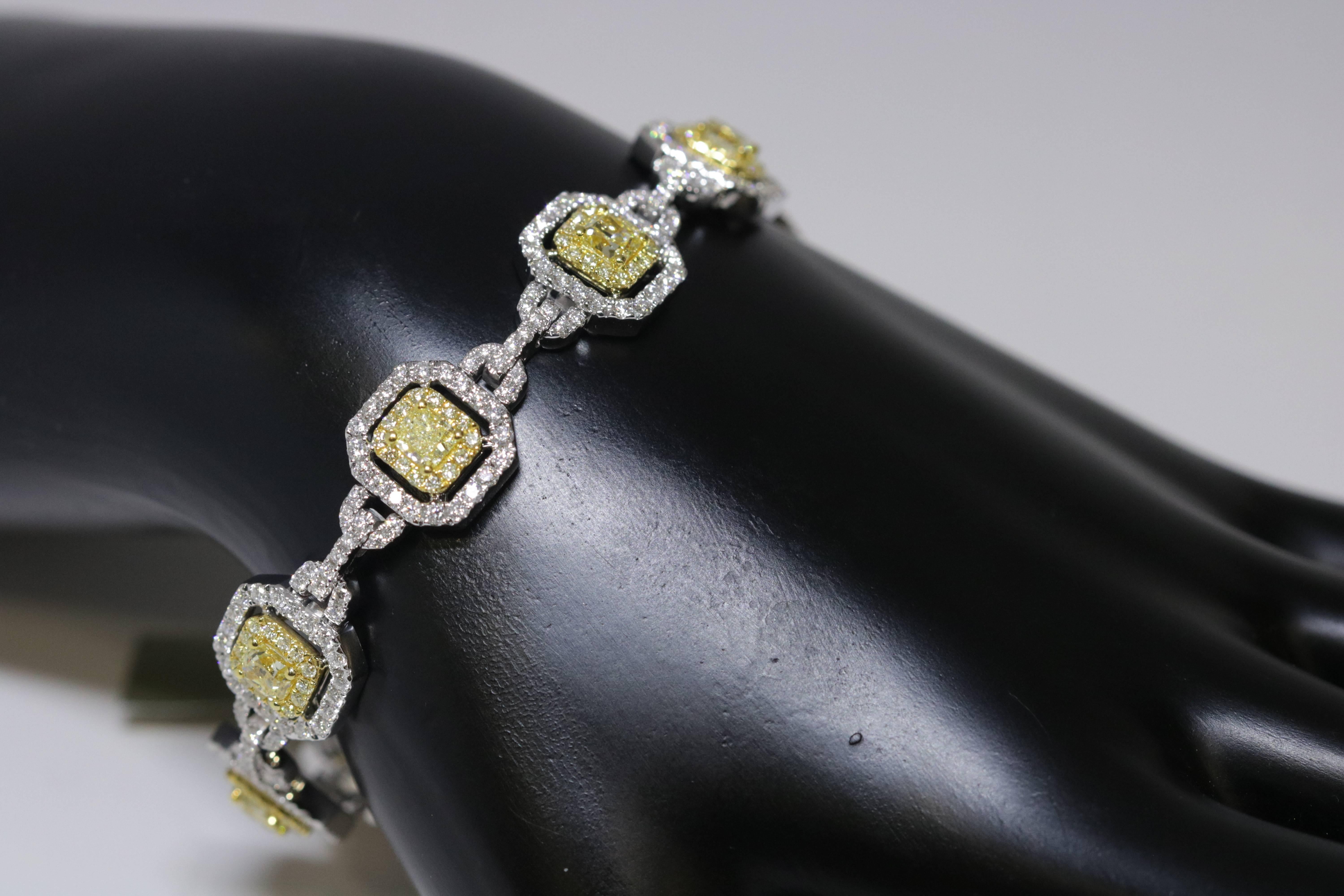Beautiful art deco inspired ladies bracelet with white and fancy yellow diamonds. Total diamond weight is 7.84ct.