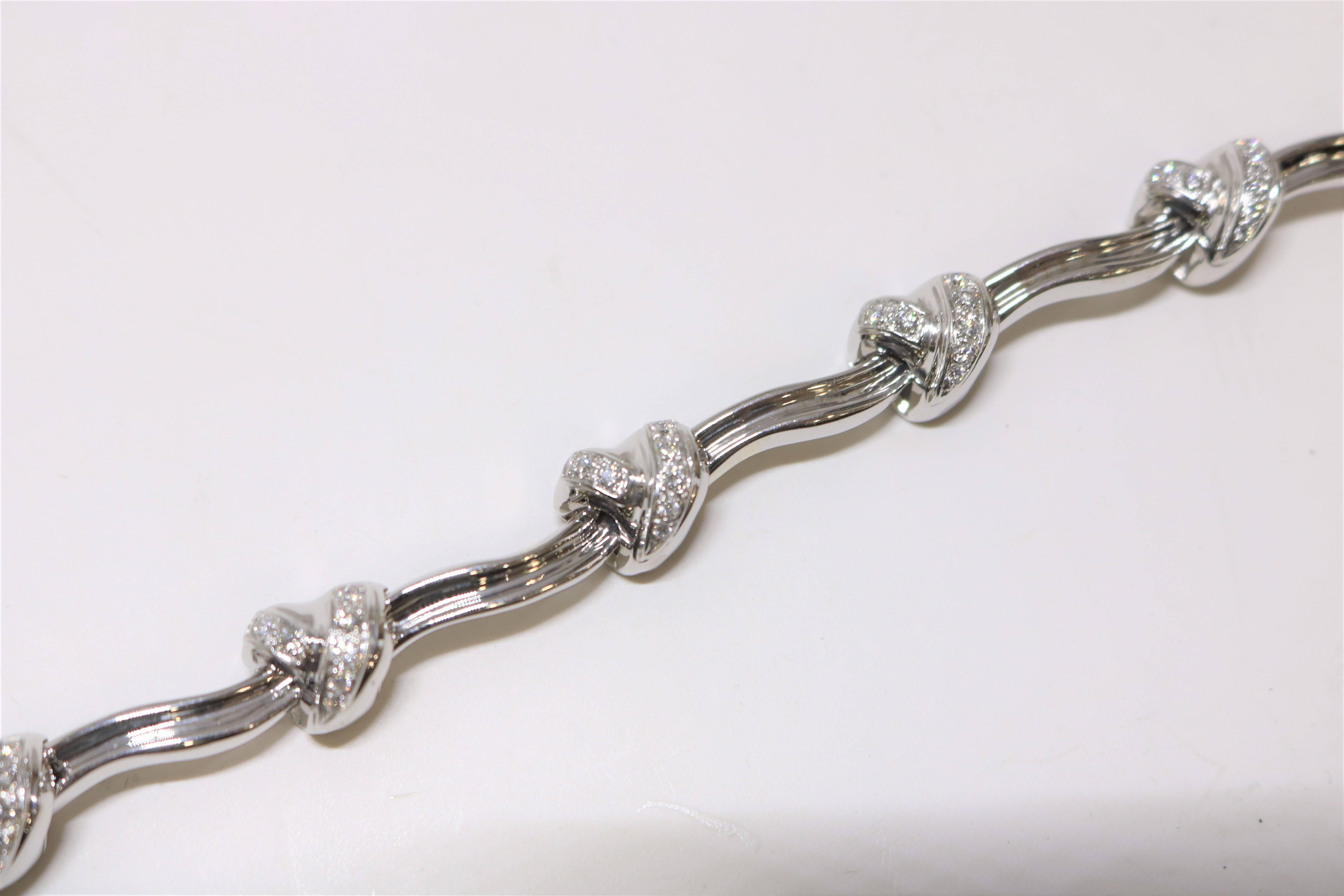 This bracelet is in 18k white gold set in a unusual "knot" style with diamonds on each knot with a total weight of 1.14 cts. 