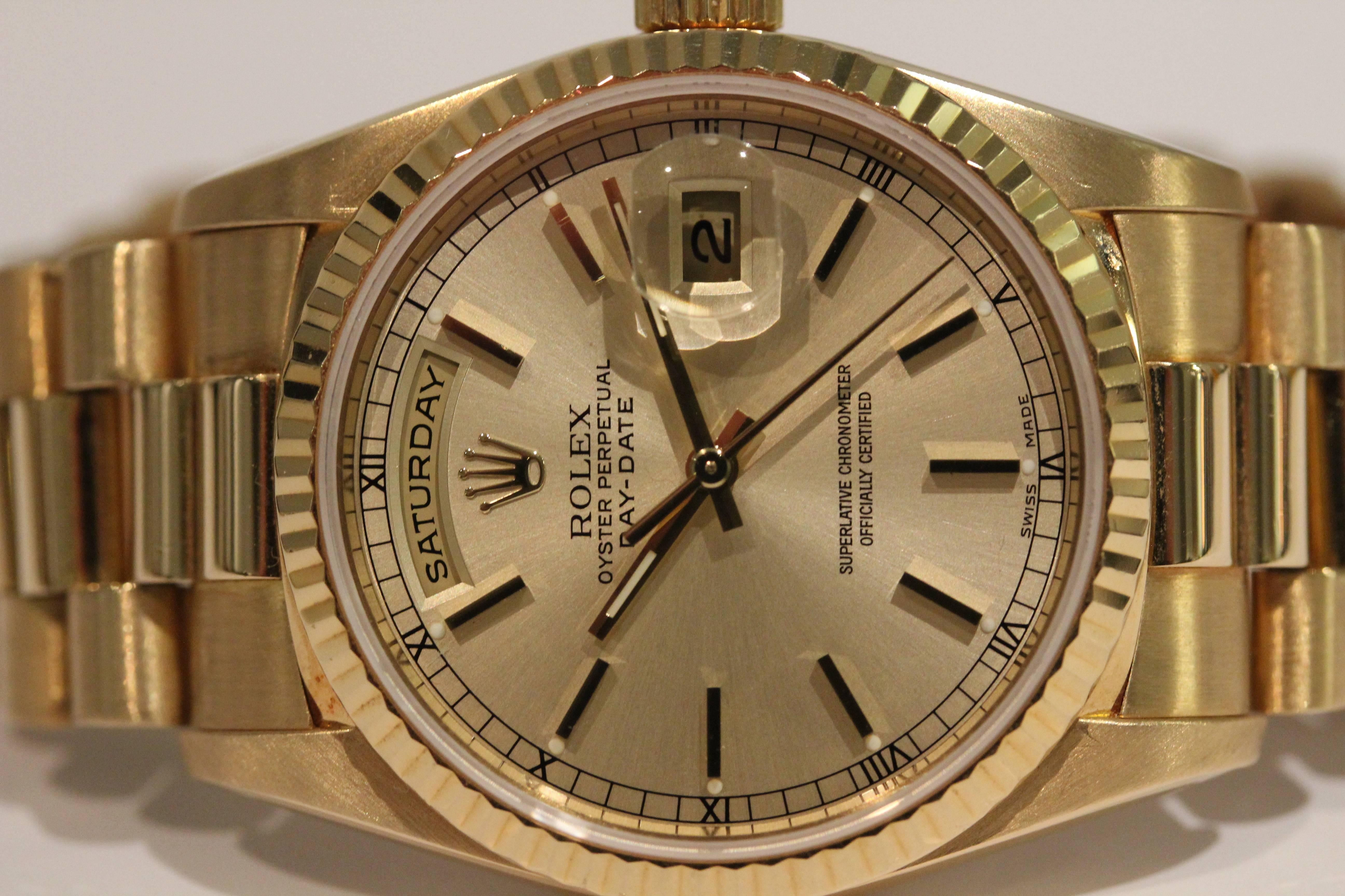 18 karat yellow gold Rolex day date. This watch has a president bracelet. 36 millimeter. Model #18238 serial #W845396. Circa 1995