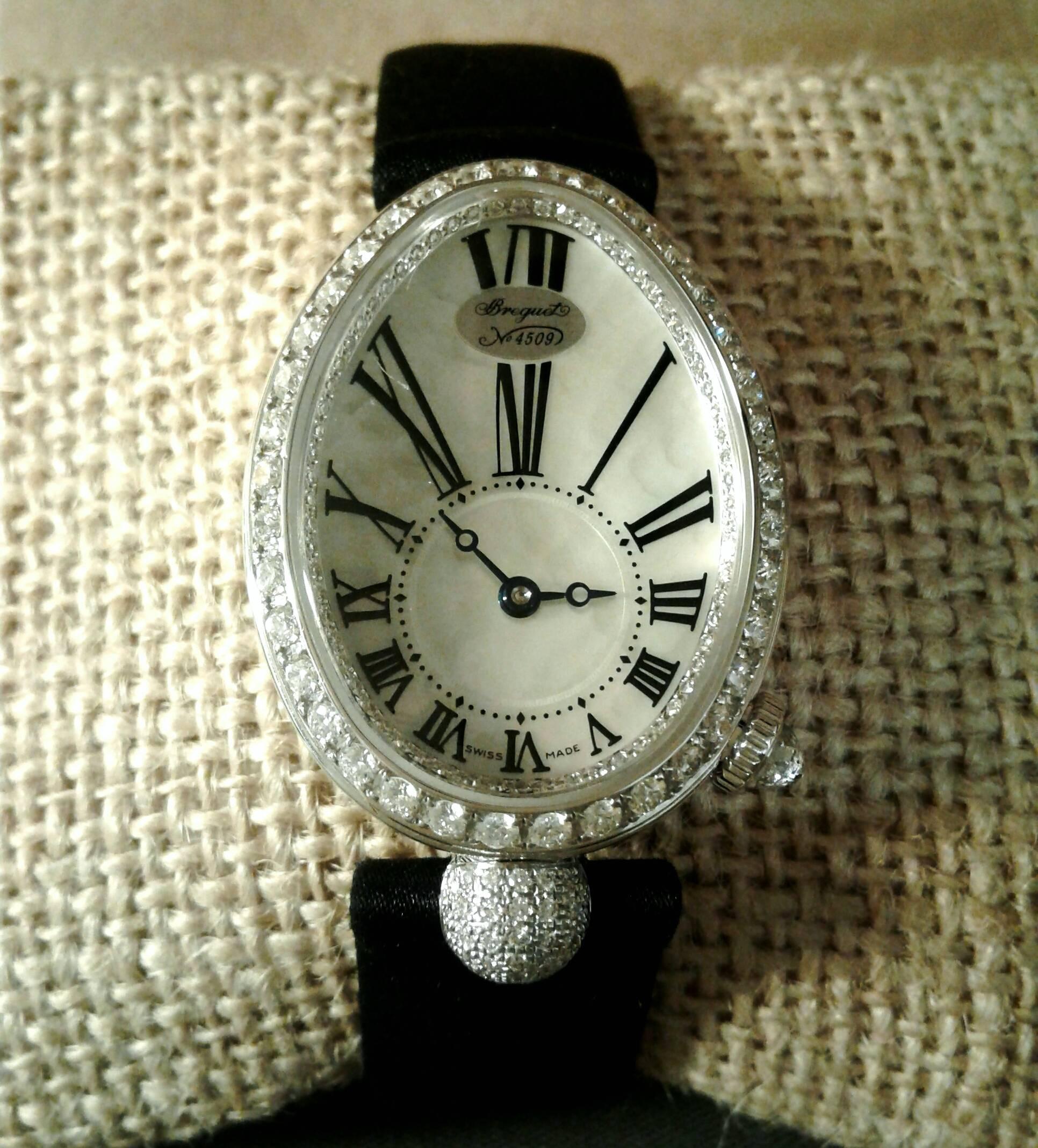 Vintage 18 karat white gold Breguet Queen of Naples Mother of Pearl dial watch with diamond bezel. The timepiece has an automatic movement and features an exhibition case back. The model number is 8928BB51844DD0D.  The serial number is 4509.  No box