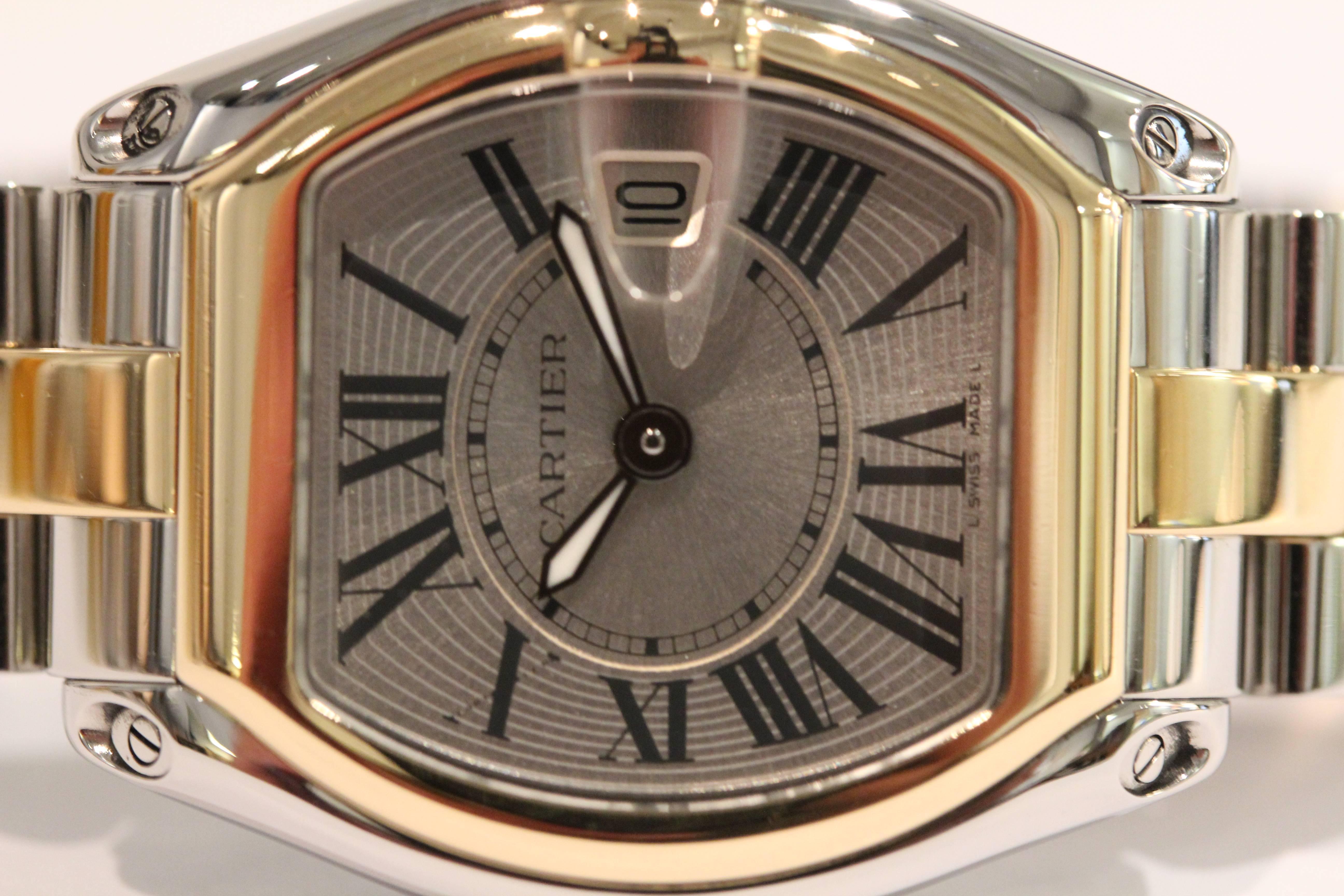 Cartier stainless steel and 18k yellow gold Roadster with silvered Roman
numeral dial. The watch has a quartz movement. Serial #615060MX 2675 with
Box and leather deployment strap.