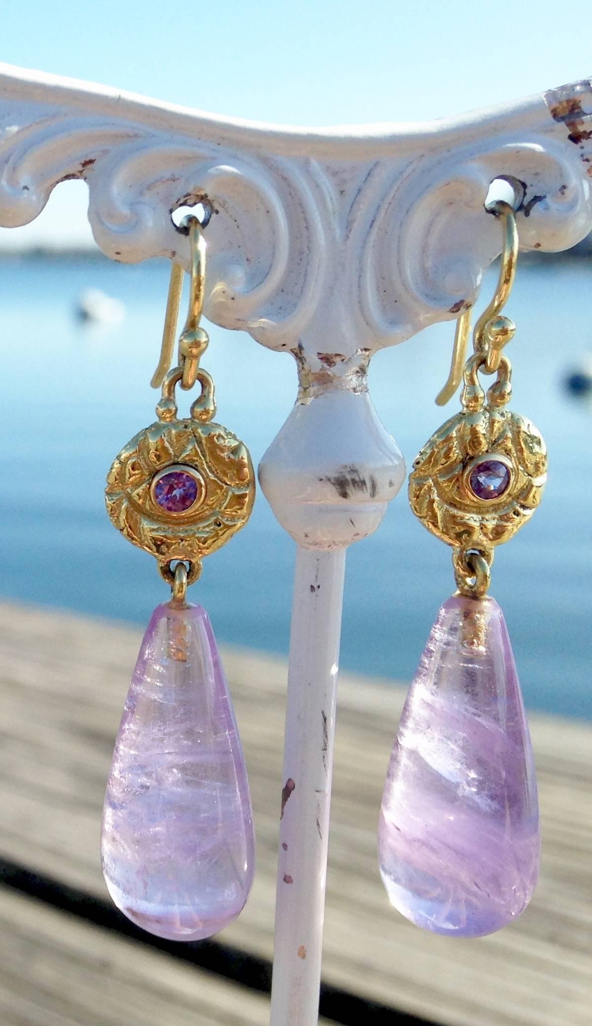 These lovely earrings are made of Lilac Sapphires set in 18kt textured Gold Discs with 25.5ct Amethysts drops.  