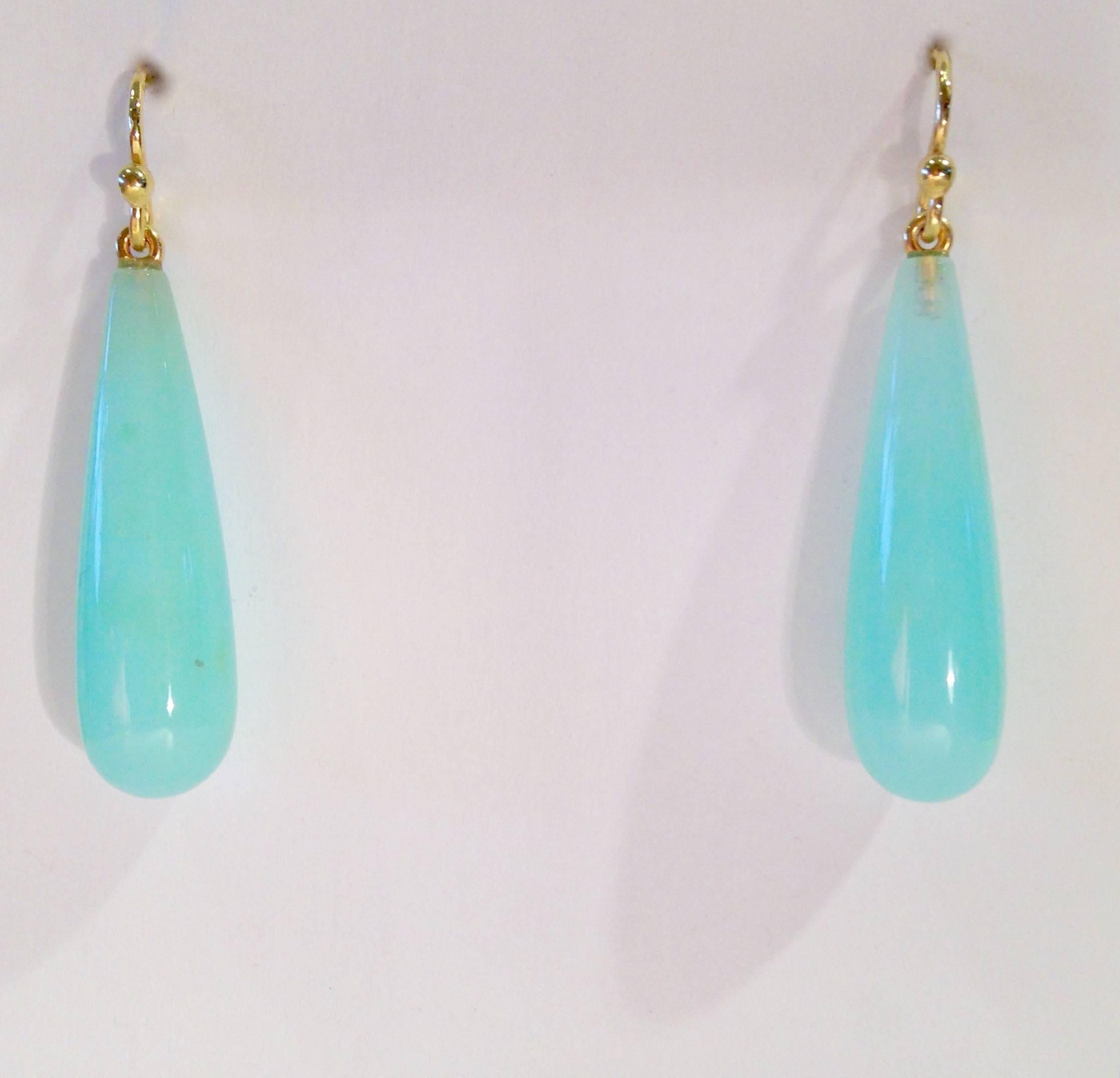 These earrings are made of tear drop shaped Blue Peruvian Opals set in 18k Gold wires.