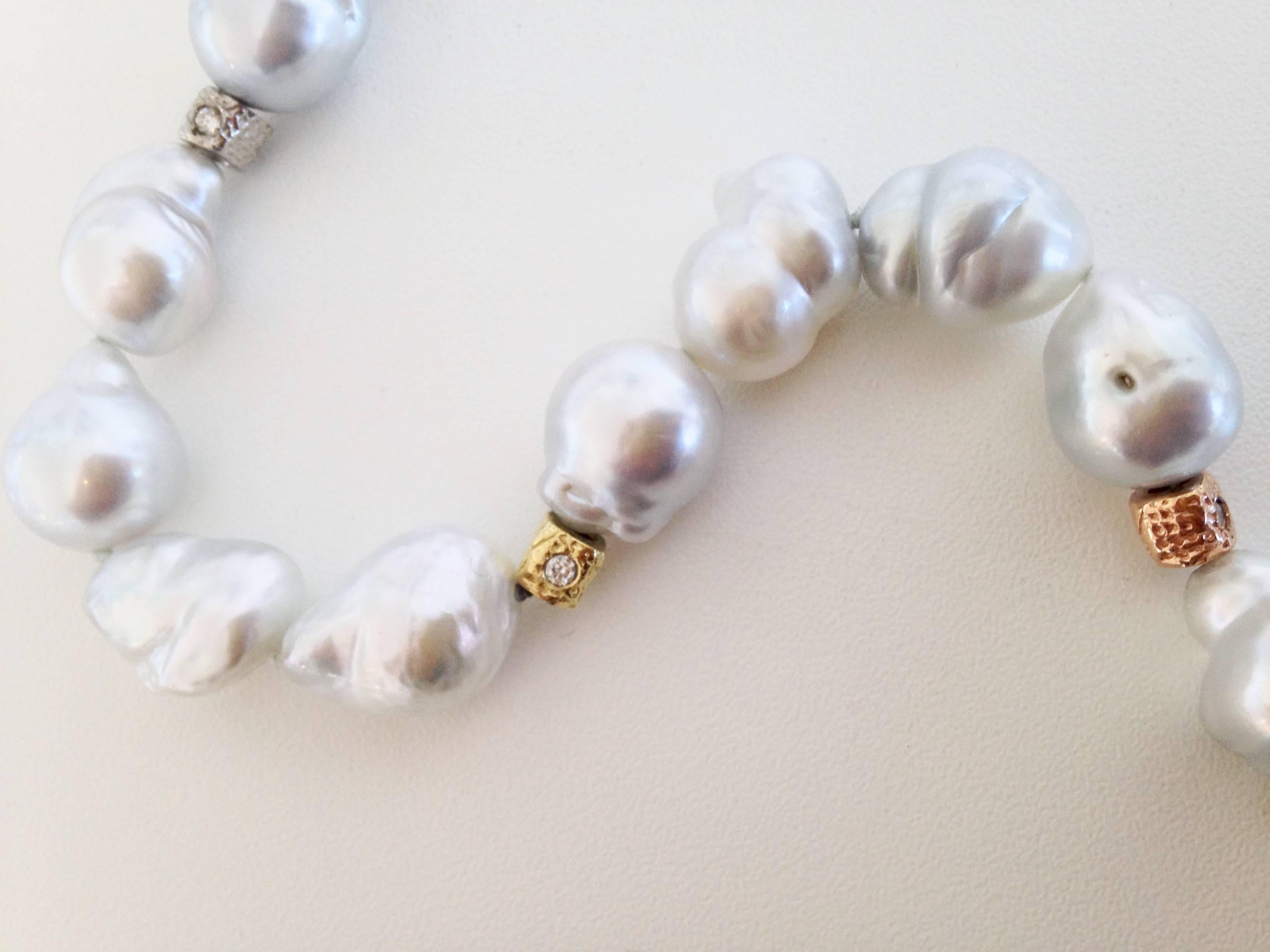 In this piece Susan has combined the alluring color and form of Silver-White Baroque Pearls with Yellow, Pink and White Gold Beads inlaid with Diamonds.  This artful and detailed strand is finished with one of Susan's 18kt Yellow Gold and Diamond