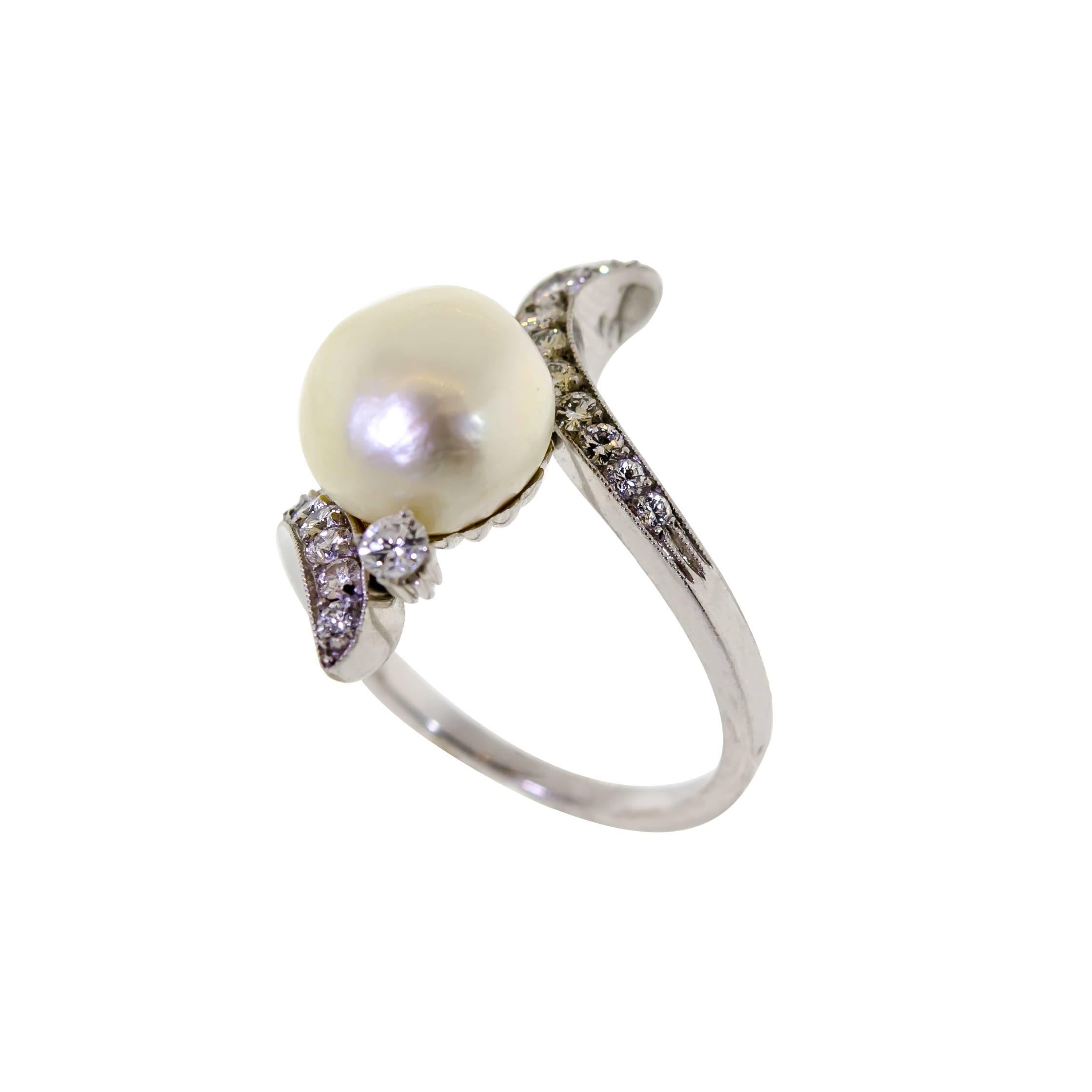 Vintage platinum cultured pearl and diamond ring Set with numerous round brilliant cut diamonds. Total weight approximately .40 cts. Pearl approximately 10mm. Excellent condition.

Ring is currently size 6 plus but can be resized. 