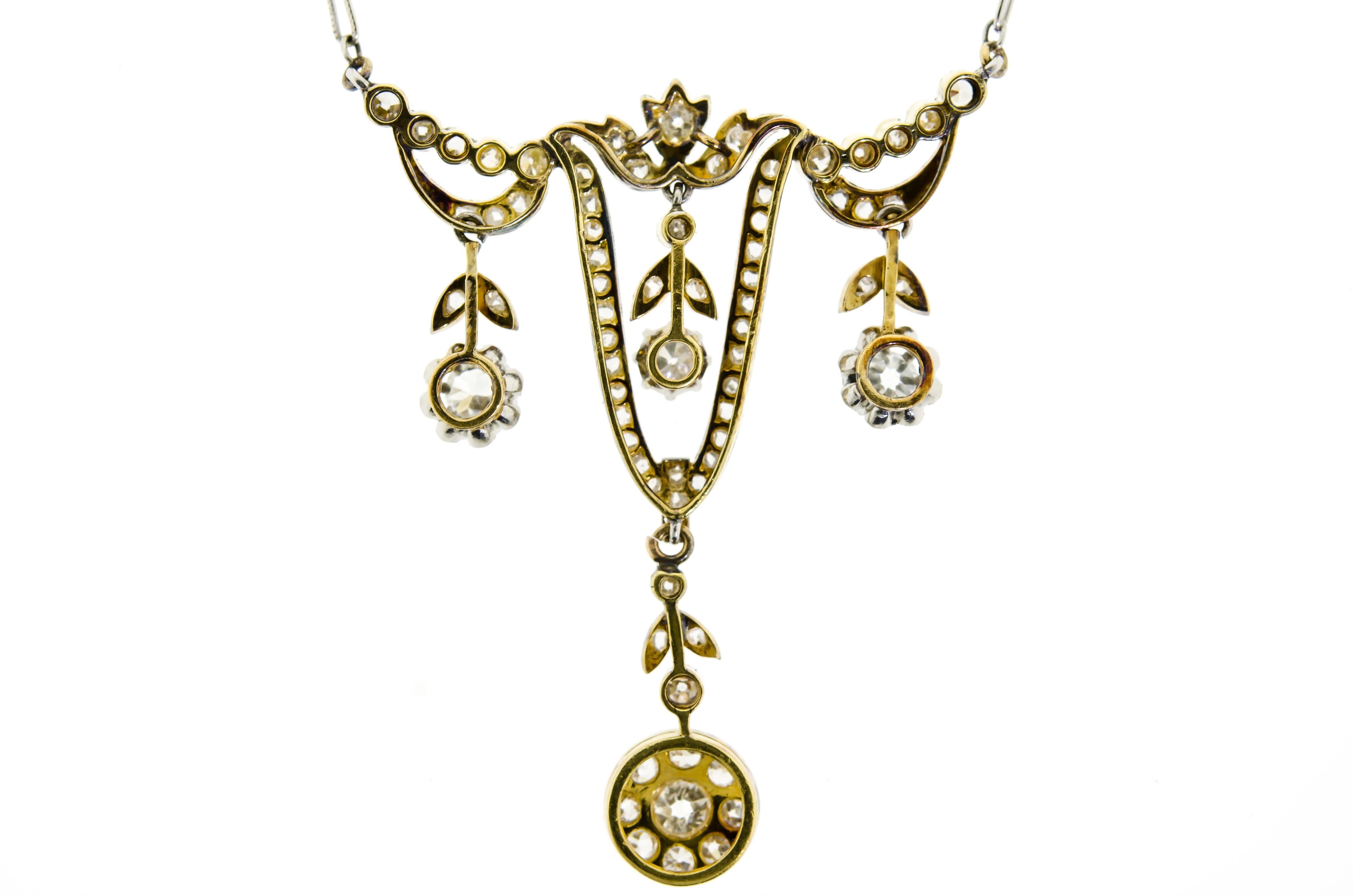 Edwardian turn of the century diamond and platinum topped yellow gold necklace - swag style with four drops - diamond platinum topped yellow gold with 14K white gold fancy link chain sping ring clasp. Overall approximate total diamond carat weight