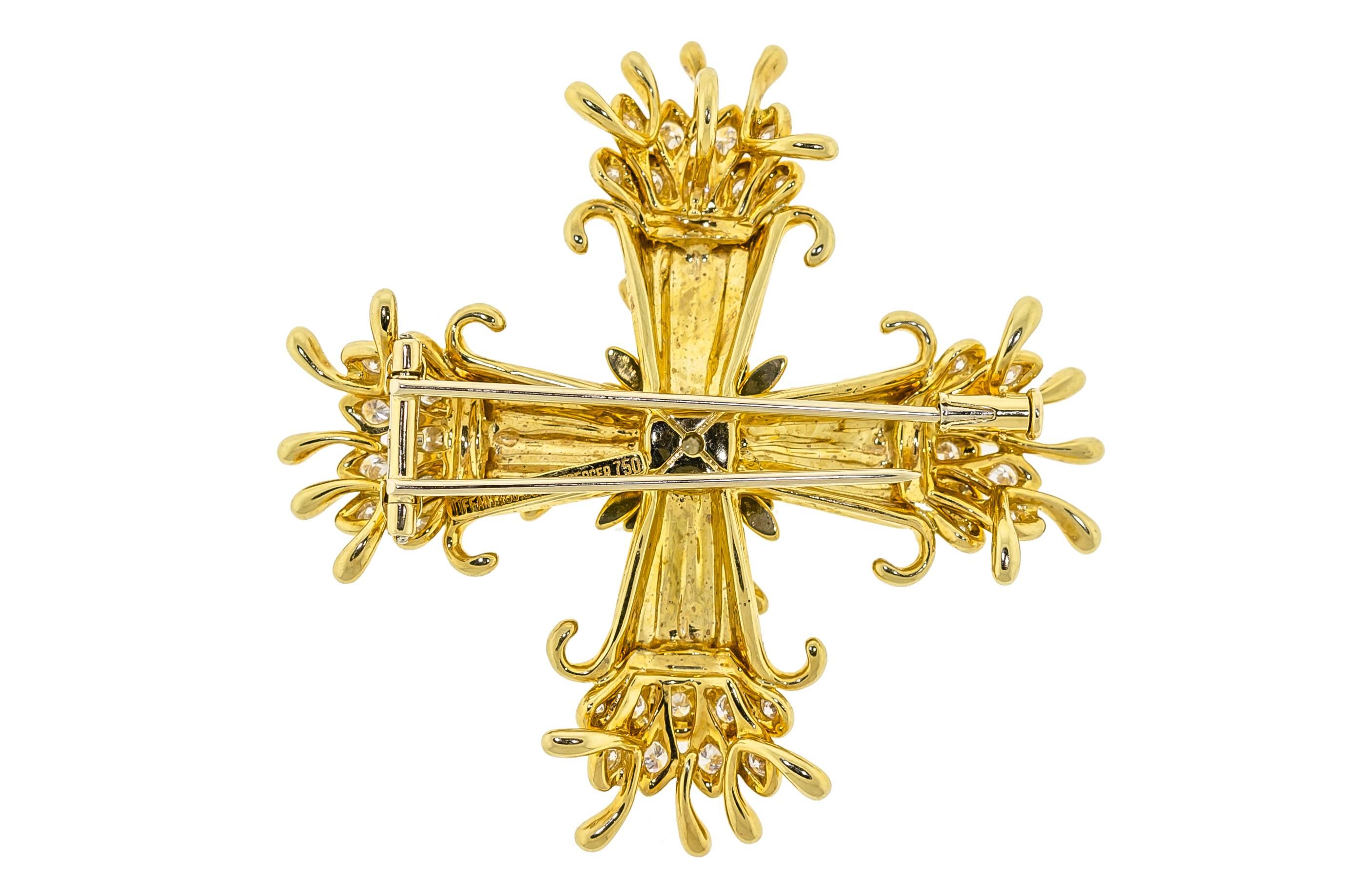 An 18 Karat Yellow Gold and Diamond Maltese Cross Pendant/Brooch, Schlumberger for Tiffany & Co., consisting of a polished cruciform base with freeform wirework accents, containing 37 round brilliant cut diamonds weighing approximately 1.25-1.30