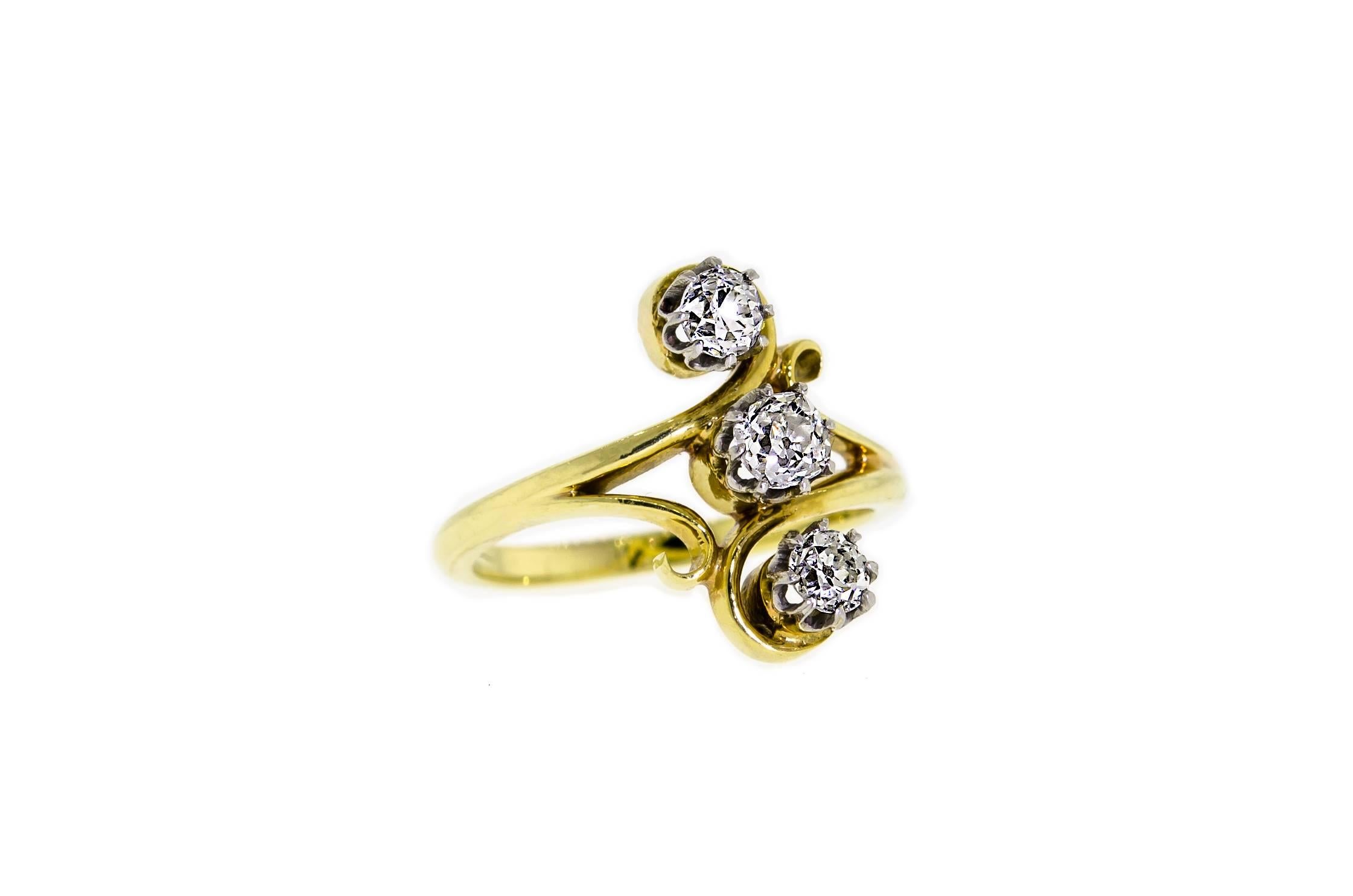 This lovely lady's, Art Nouveau, Circa 1900, 18kt yellow gold ring set with three dazzling (3) Old European Cut diamonds with an approximate total weight of 0.95 - 1.00cts is such an enchanting diamond ring.  

Excellent clean Old European Cut