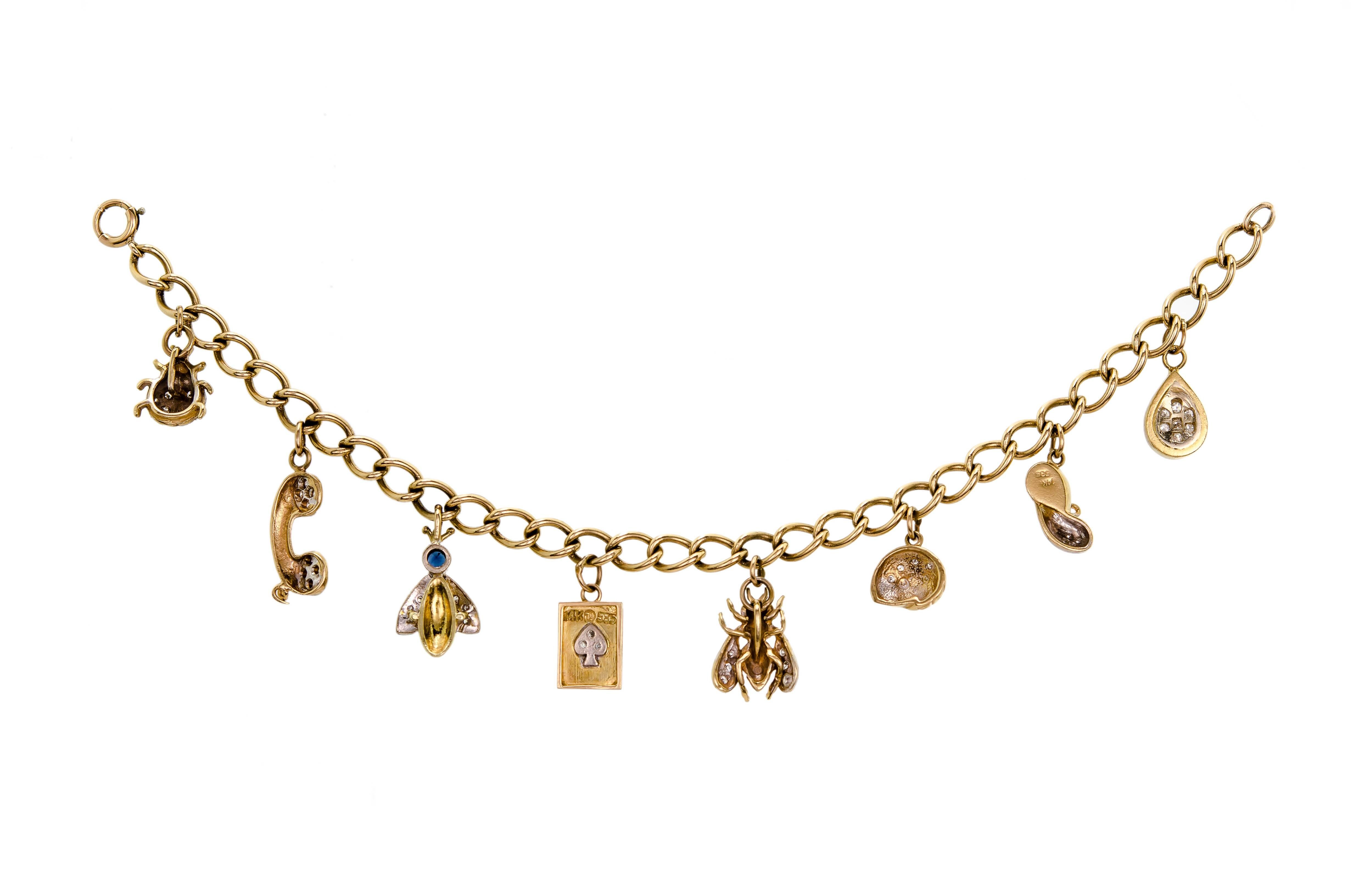 Charming 1940-50 14kt yellow gold and diamond charm bracelet with 8 14kt yellow gold and diamond charms. Wonderful charm bracelet. Excellent condition. Spring ring clasp. Unusual to find all diamond accented charm bracelet. A must have!!