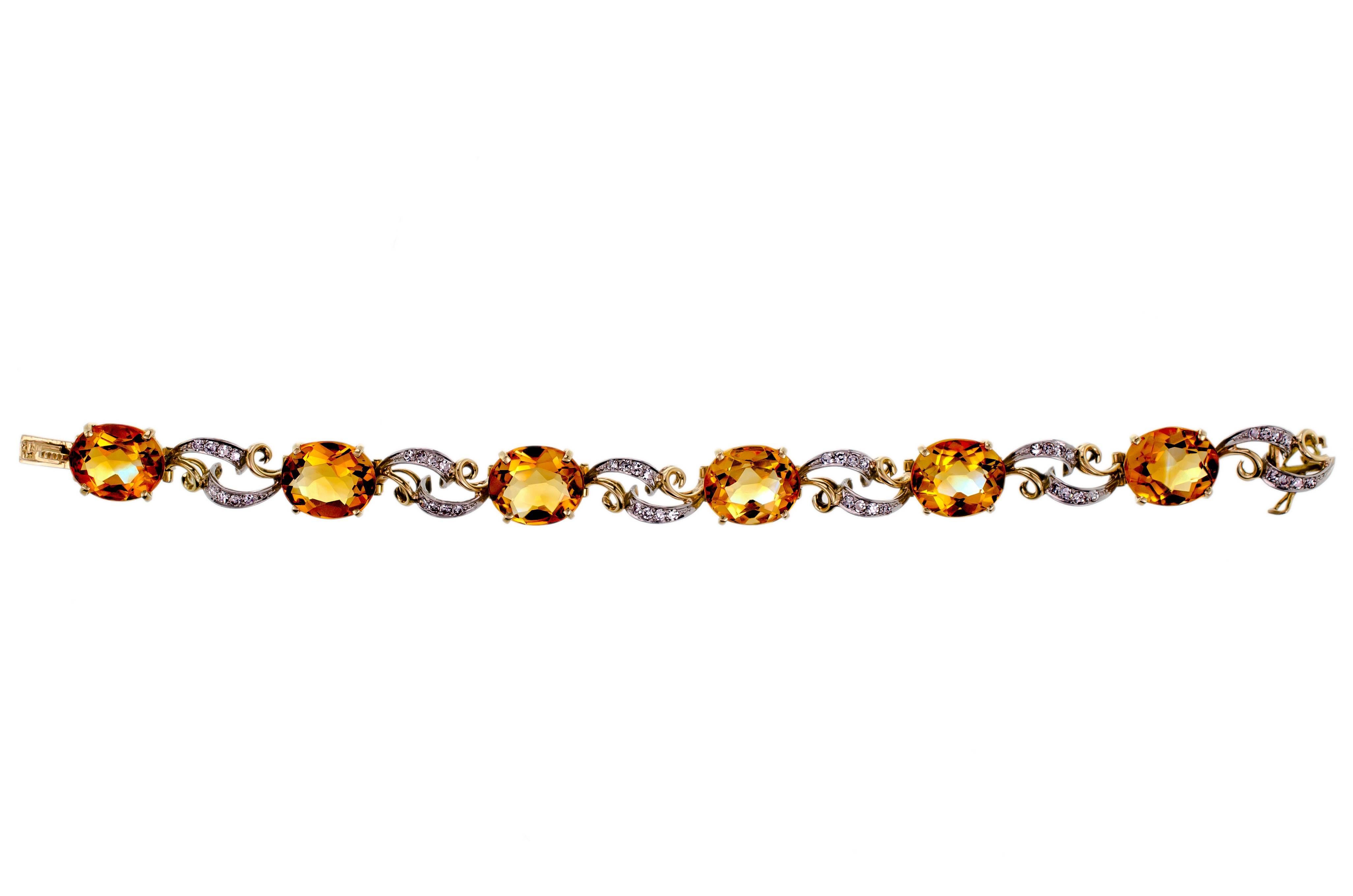 Beautifulvintage citrine and diamond flexible bracelet set with six (6) oval mixed cut citrines measuring approximately 12.5 x 10.2 mm further accented with 48 single cut diamonds with an approximate weight of .60 cts total set into a platinum and