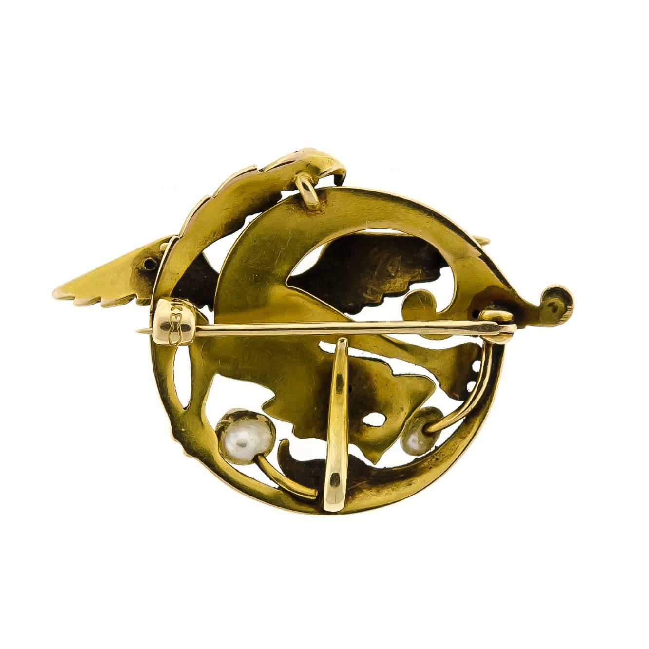 Art Nouveau circa 1900 brooch containing two (2) baroque pearls set into an elaborate 14kt yellow gold winged chimera  (dragon, griffin). Reverse: c-catch, ball hinge, pin stem, watch hook all original 