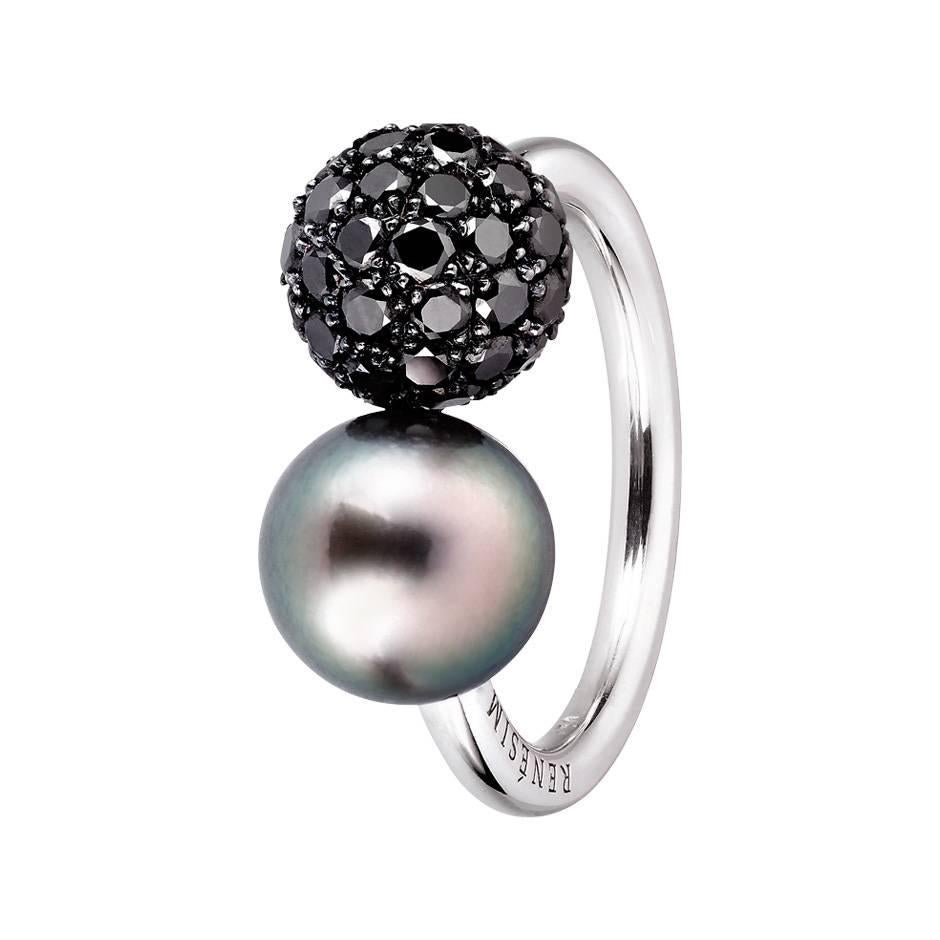 This extravagant 18K white gold ring features two decorative spheres. One sphere is a Tahitian pearl and the other sphere is covered black pave diamonds, with a total weight of 1.98 ct. Both spheres have a diameter of 9 mm.