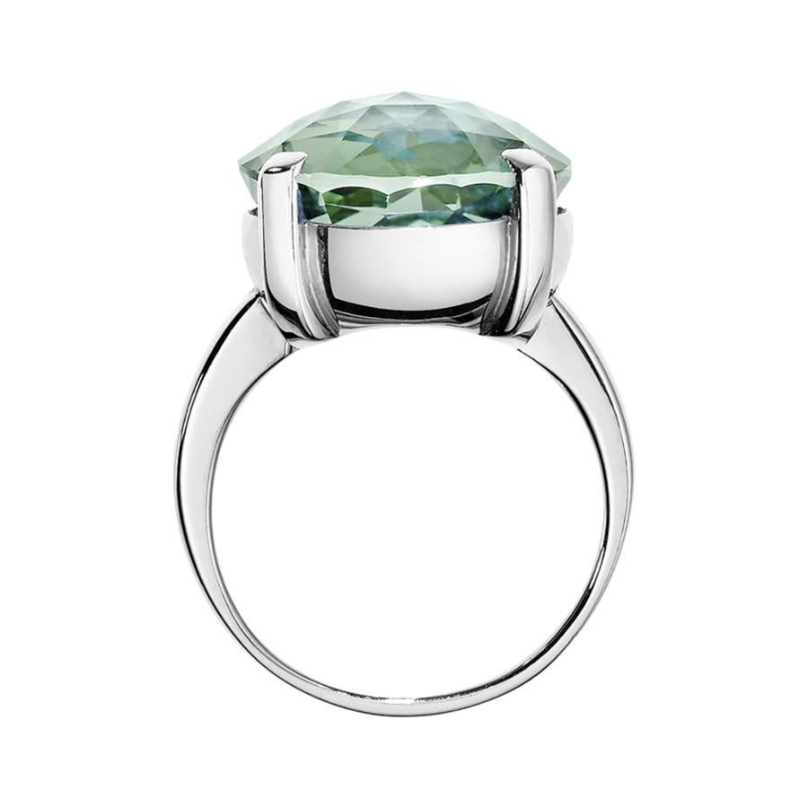 This modern cocktail ring features a facetted green amethyst (13 mm) in a classic prong setting. The ring is crafted in 18 karat white gold and is available in yellow gold, rose gold and platinum upon request.