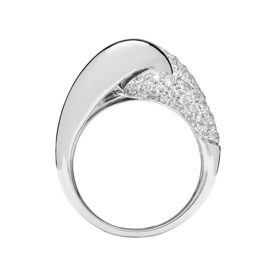 This sophisticated cocktail ring is designed as an asymmetrical knot, featuring delicate pave diamonds with a total weight of 1.04 ct. The ring is crafted in 18 karat white gold and is available in yellow gold, rose gold and platinum upon request. 