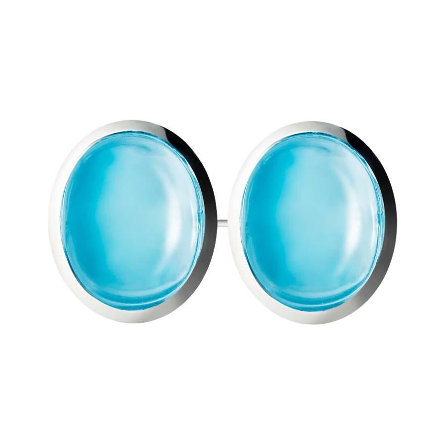 These stunning gemstone cufflinks feature 4 sky blue topaz cabochons (8 x 6 mm) in a classic 18k white gold setting. They are also available in 18K yellow gold, rose gold and platinum upon request. 