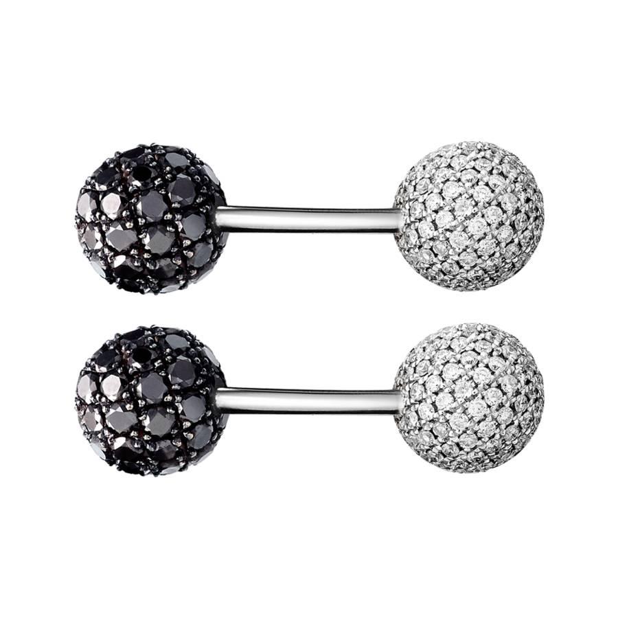 These modern cufflinks are made from 18k white gold with two spheres of captivating black and white pave diamonds.