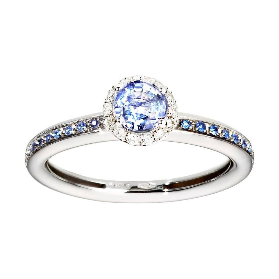 This elegant 18K white gold ring features a striking blue sapphire, framed by delicate white diamonds. There are further channel-set blue sapphires along the band.

Details
Ring size: 55 (US size 7)
Band width: 2.9 mm
Blue sapphires: total weight of