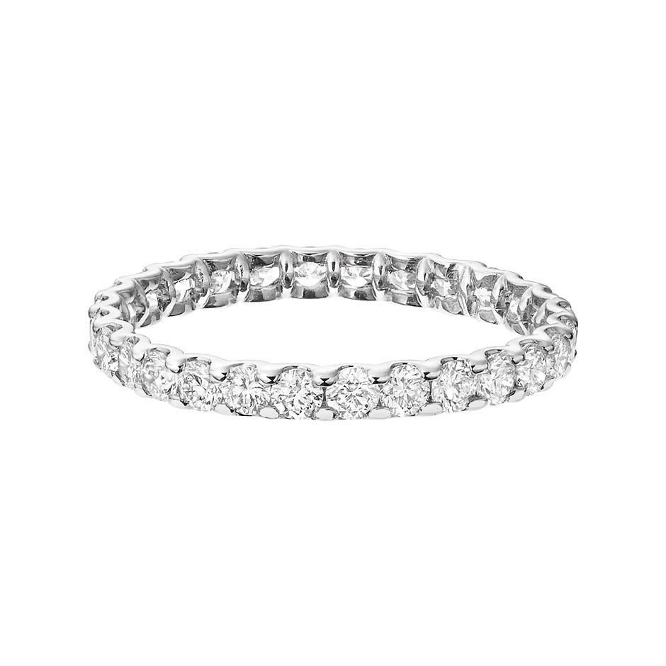 This classic eternity ring in 18K white gold features white diamonds full circle. The diamonds are 0.05 ct each with color and clarity values of G VS. The ring is a size 53 (US size 6.5).