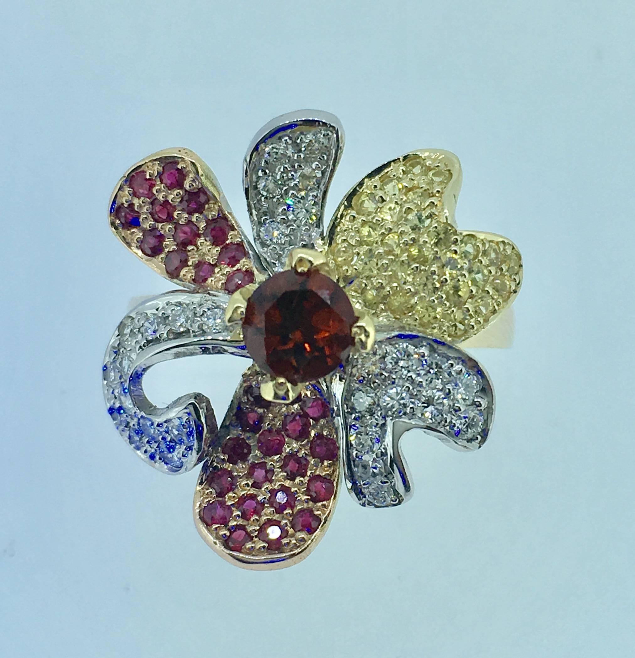 Beautiful Flower shape Romantic ring designed and manufactured by Steven van Giel for Cherubine .
This od rin is flaked with 0.35ct diamonds , 0.70ct yellow and red saphire and 0.5ct rubis .
The piece is signed and made in one examplary 