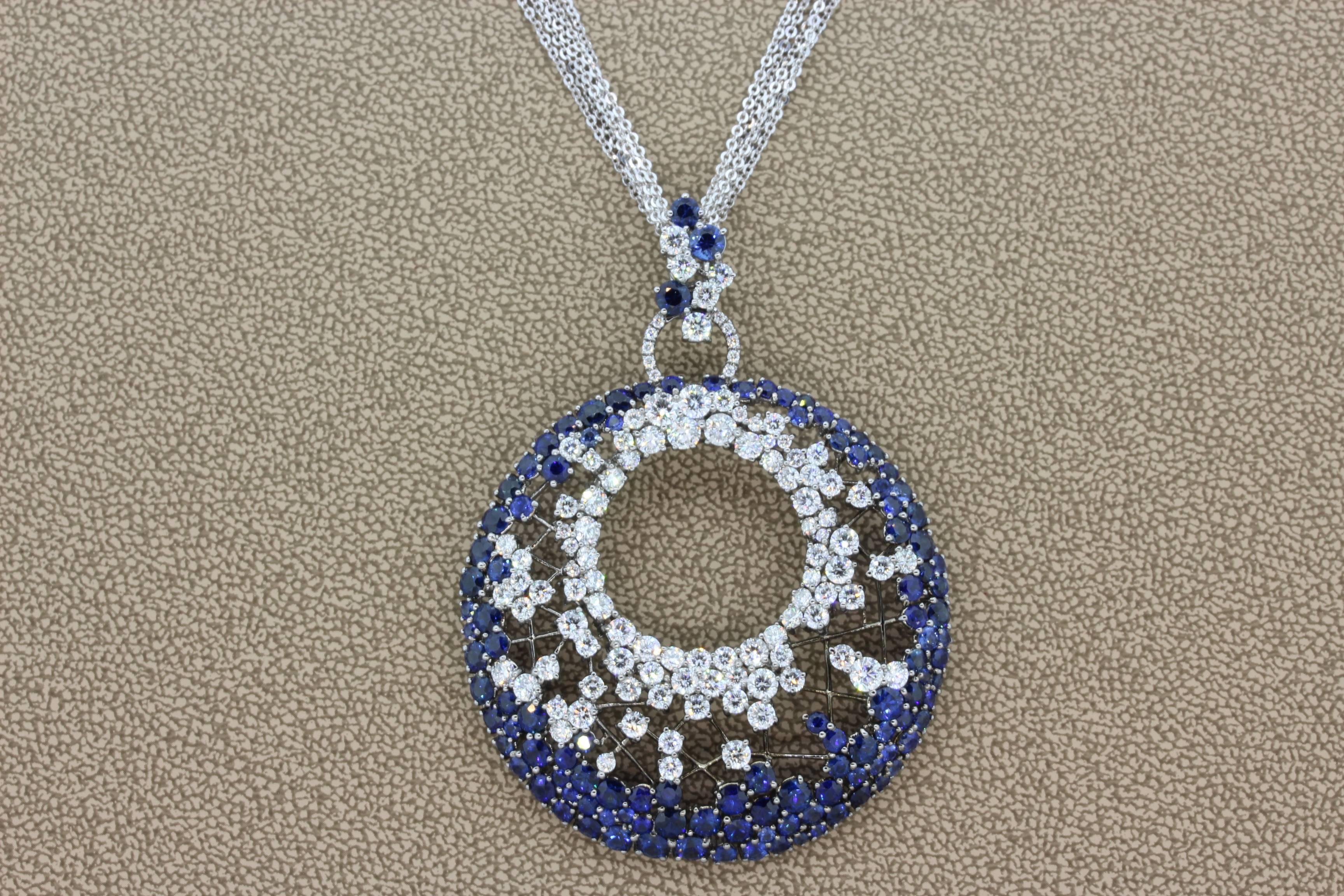 A sexy and sleek design, this pendant features 5.86 carats of VS quality round cut diamonds and 8.54 carats of vivid blue sapphires. The gems seem to be caught in a web of 18K gold. The pendant comes with a multi strand gold necklace, 17