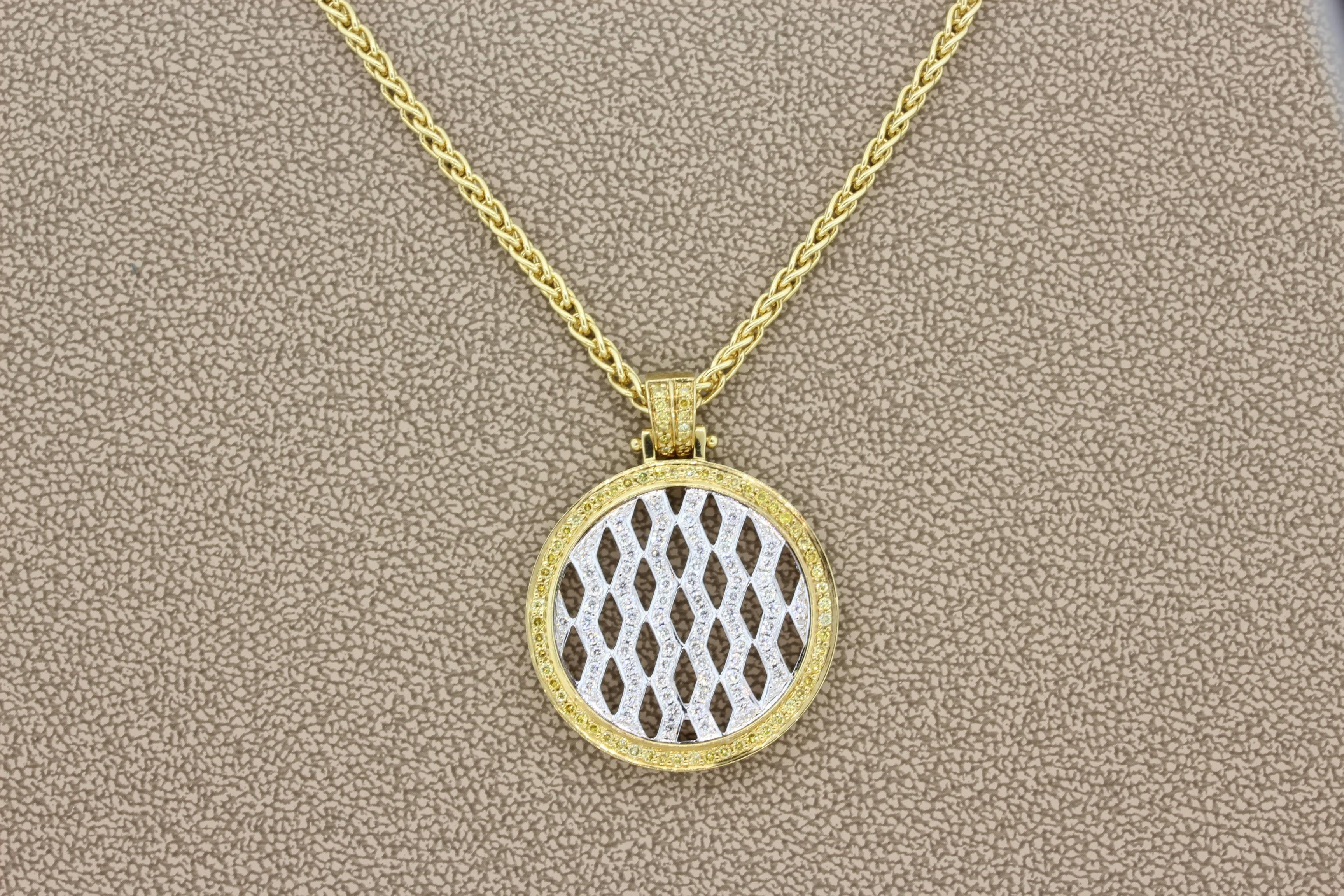 A quality made pendant by Neil Joseph which features 1.22 carats of VS quality white and yellow round cut diamonds set in 18K white and yellow gold. Made in Italy. Comes with hand made braided chain necklace, 20 inches. 

Dimensions: 1.5 x 1.1