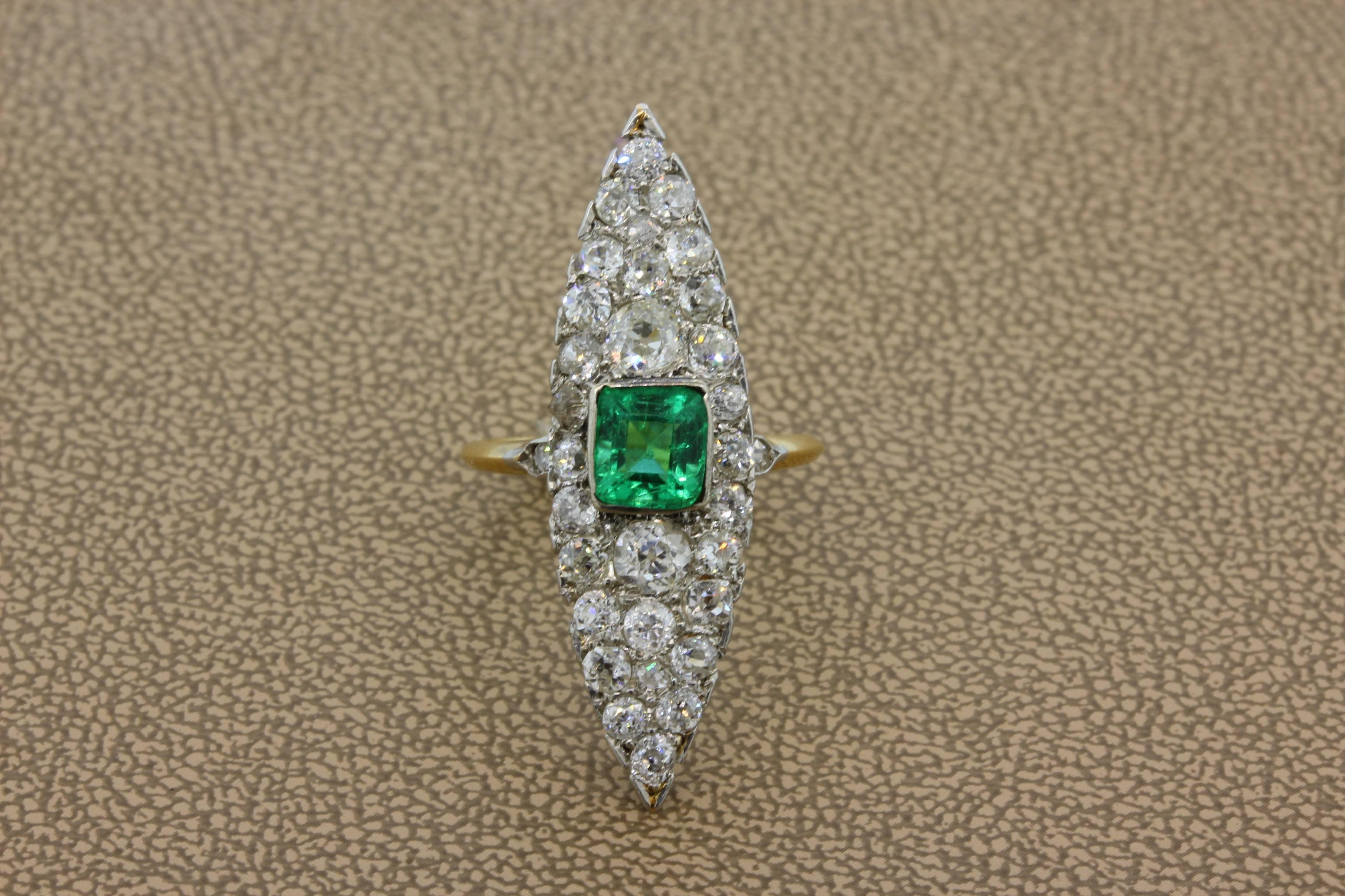 A classic Navette ring from the early 1900’s featuring a 1 carat emerald cut emerald. There are 1.94 carats of old-cut diamond accents around the luscious emerald, set in 18K yellow and white gold. 

Navette Length: 1.48 inches 

Size: 6
