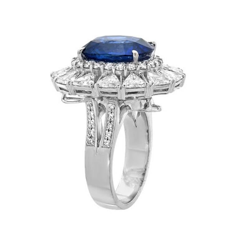 This ring features a fine 8.51 carat natural blue sapphire, GIA Certified, with 4.00 carats of brilliant white diamonds accenting the center sapphire and creating a halo. Made with 18K white gold

The piece can be worn as a pendant as well by
