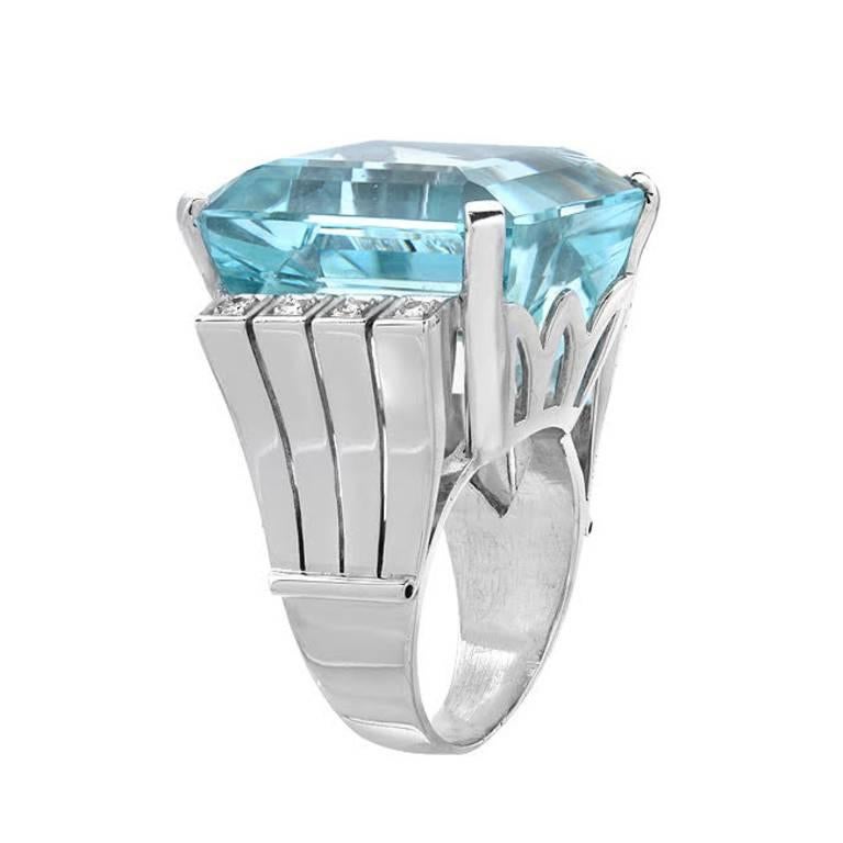 Go big or go home! This ring features a massive and impressive 60.14 carat natural aquamarine. It is accented by 0.25 carats of round cut diamonds, set in 14K white gold. A bold ring for a special woman.

Ring size 9.5