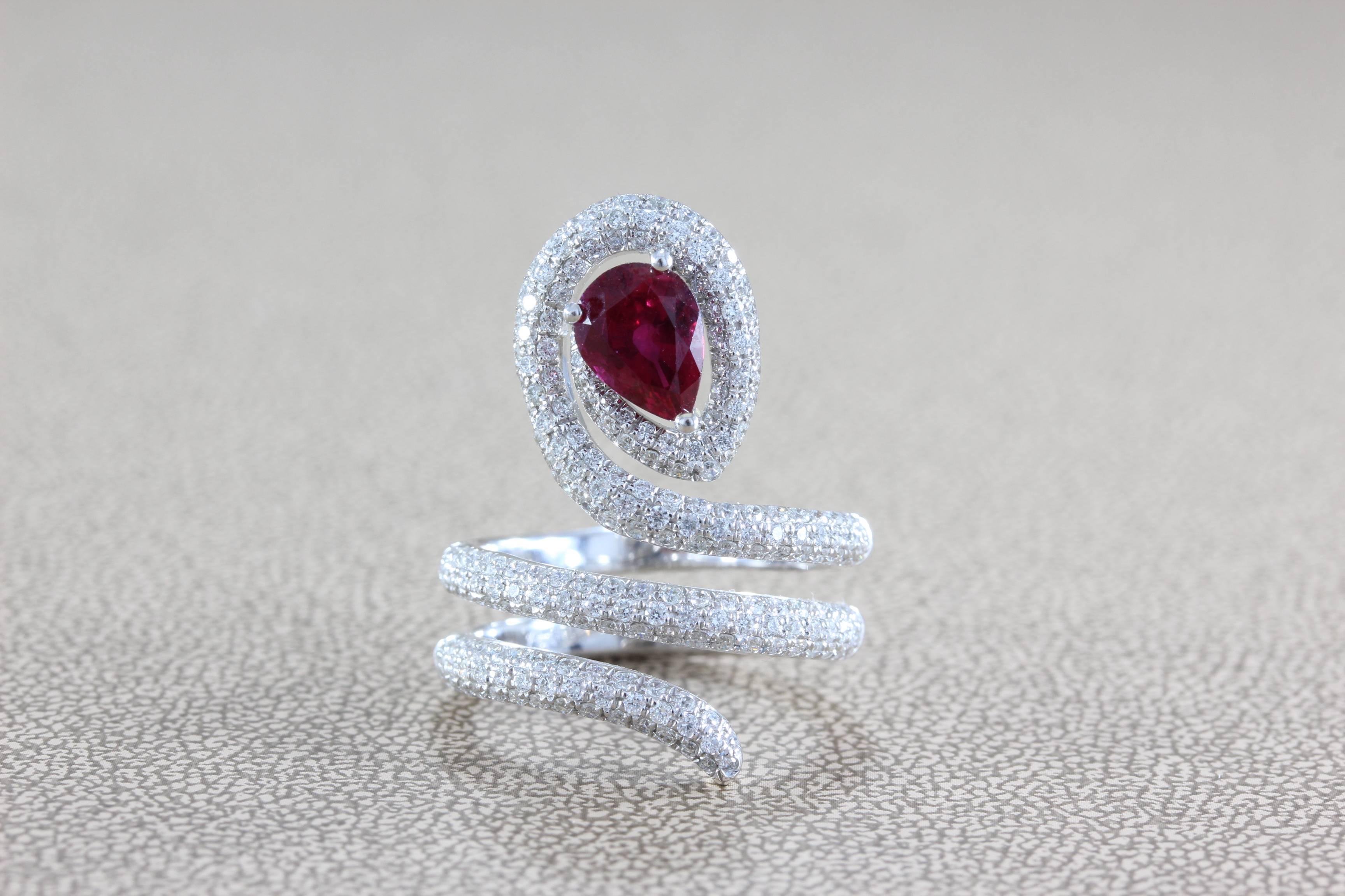 Original this snake inspired ring features a GIA Certified 1.51 carat pear shape vivid red ruby. With a great color tone and high level of color saturation, this eye clean ruby is of the highest quality. Accenting the center stone are 1.29 carats of