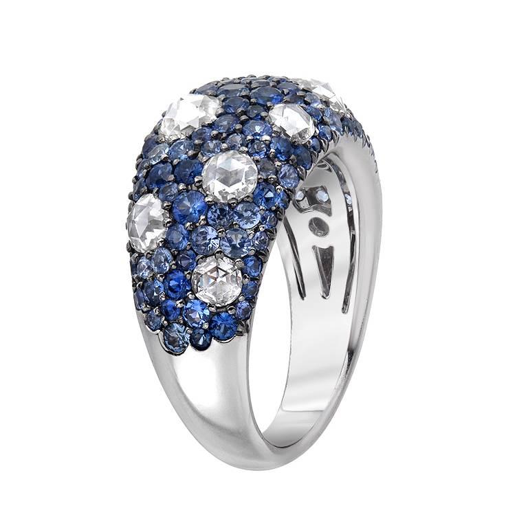 This adorably alluring domed ring features 1.40 carats of rose cut diamonds surrounded by 1.00 carat of round cut blue sapphires. Set in 18K white gold this lovely ring can be worn every day or dressed up.

Currently ring size 6.25
