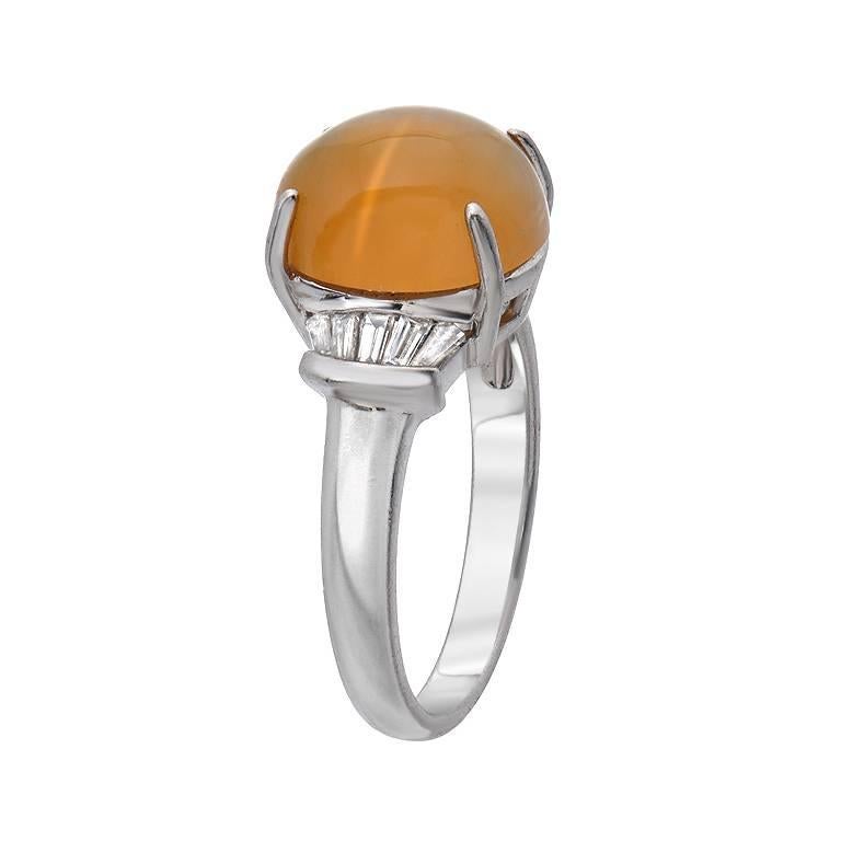 This estate piece features a 3.40 carat cat's-eye gemstone with a very strong cat's-eye effect. Along the sides of the gemstone are 0.22 carats of diamond. Made in platinum.

Size 6.25 (Sizable) 