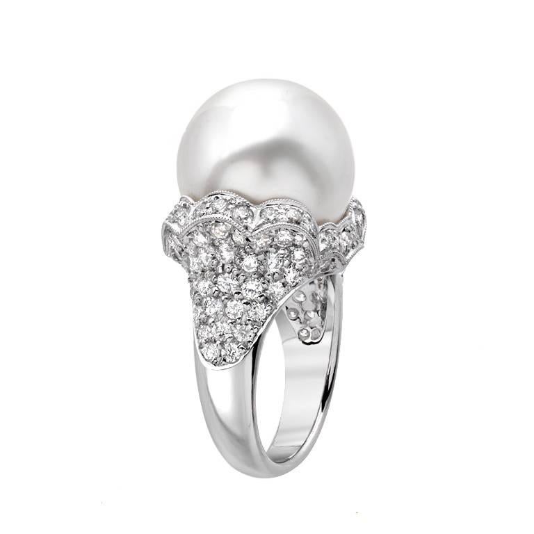 A perfectly round 15.5mm South Sea pearl is featured in this gold cocktail ring. The lustrous pearl is surrounded by 2.40 carats of round brilliant cut diamonds set in 18K white gold.

Ring size 5.5
