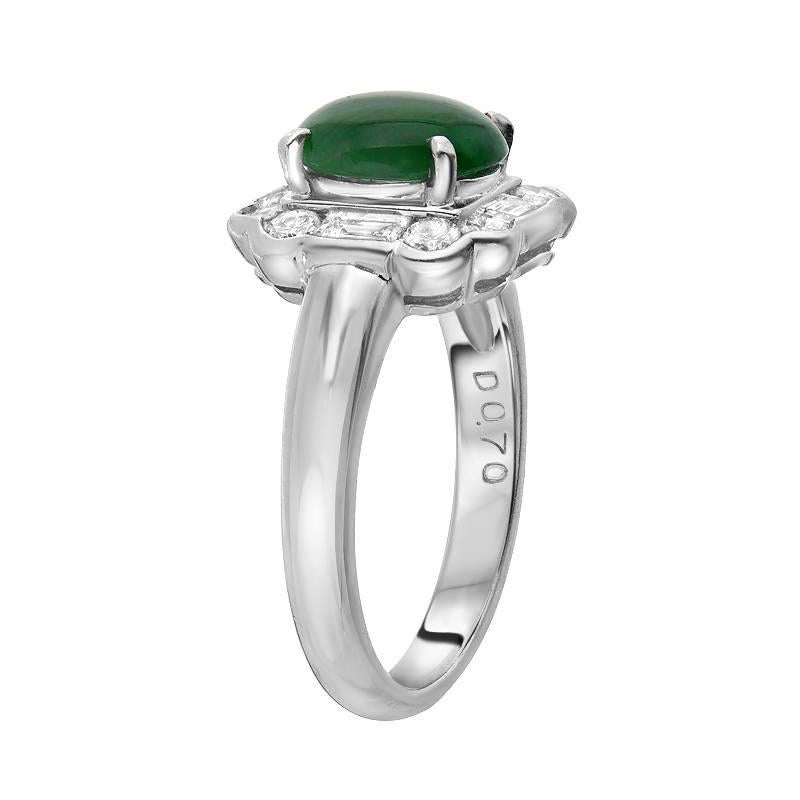 Delicate and sweet! This simple yet beautifully made ring features a 1.85 carat piece of natural green jadeite jade. It is haloed by 0.70 carats of round and baguette cut diamonds set in platinum giving the ring a unique look.  

Ring size 6.25
