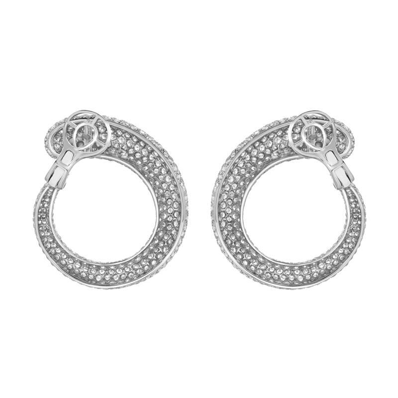 A magnificent pair of earrings featuring 9.41 carats of colorless VS quality diamonds pave set in 18K white gold.  The detail in the craftsmanship of these earrings come second to none - from the quality of the diamonds and their setting to the work